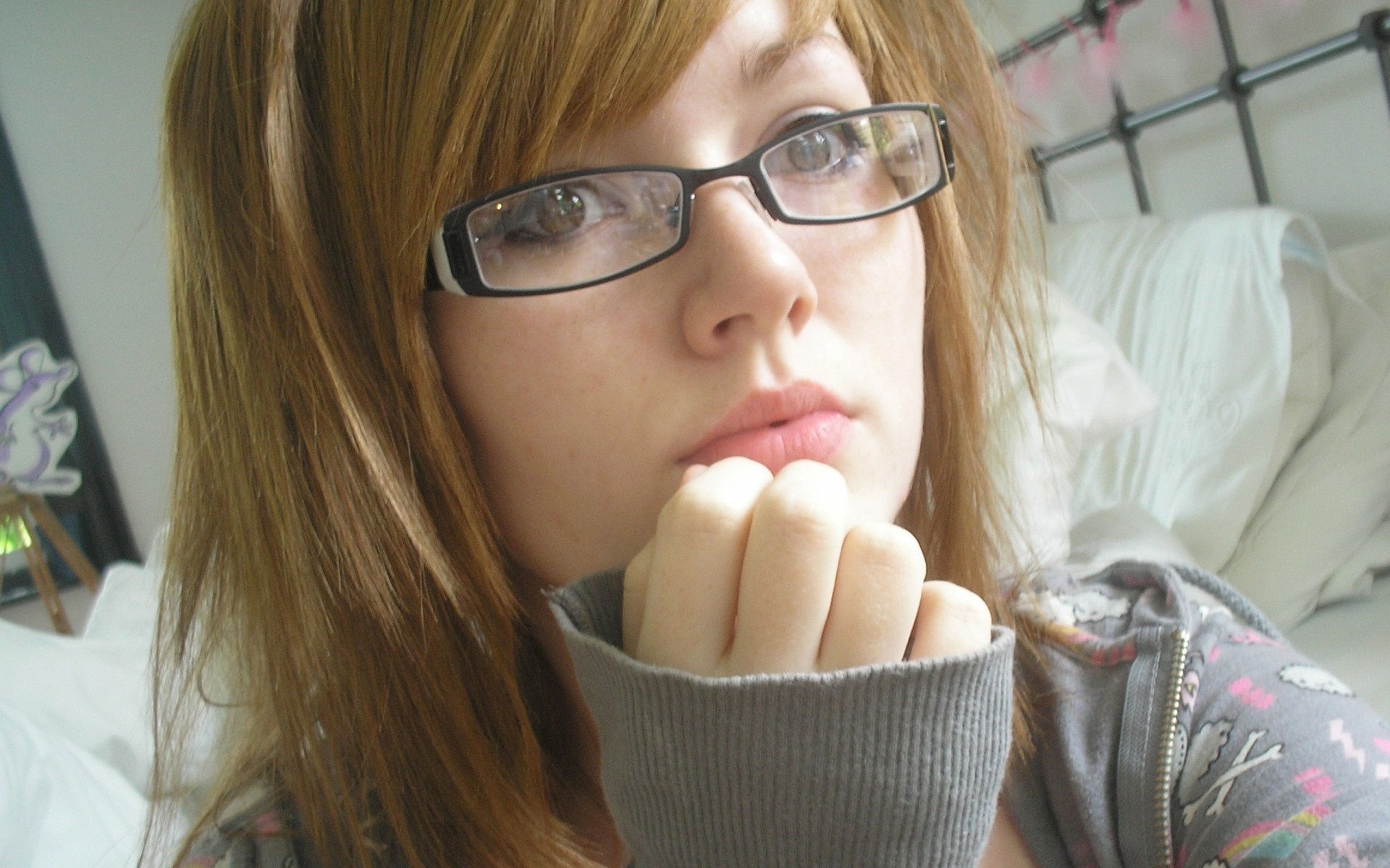 Young woman with auburn hair wearing glasses HD Wallpaper