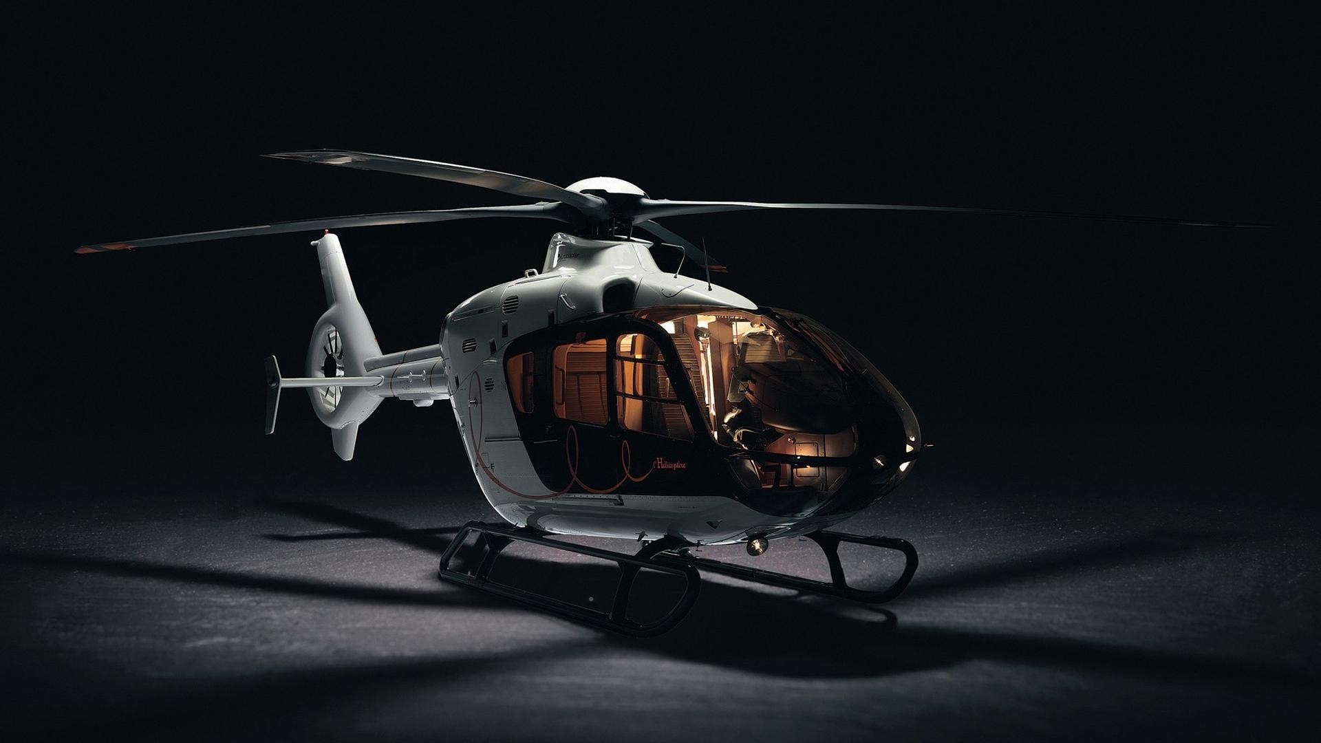 White helicopter with tinted windows on a dark surface HD Wallpaper