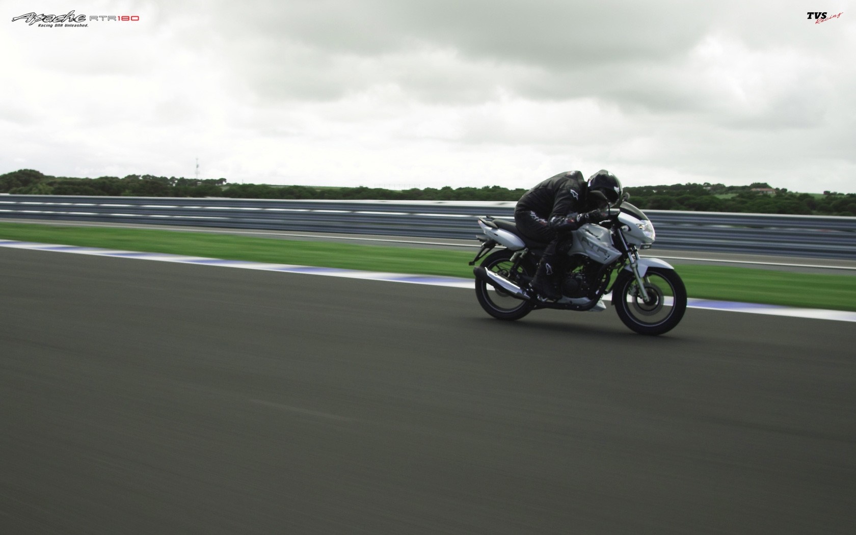 TVS Apache RTR 180 motorcycle on a race track HD Wallpaper