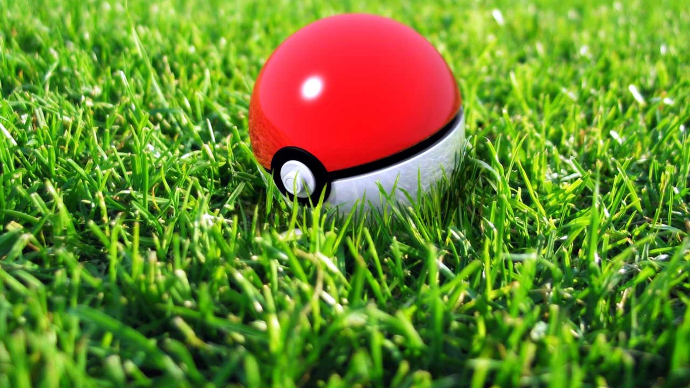 Pokemon ball on green grass HD Wallpaper