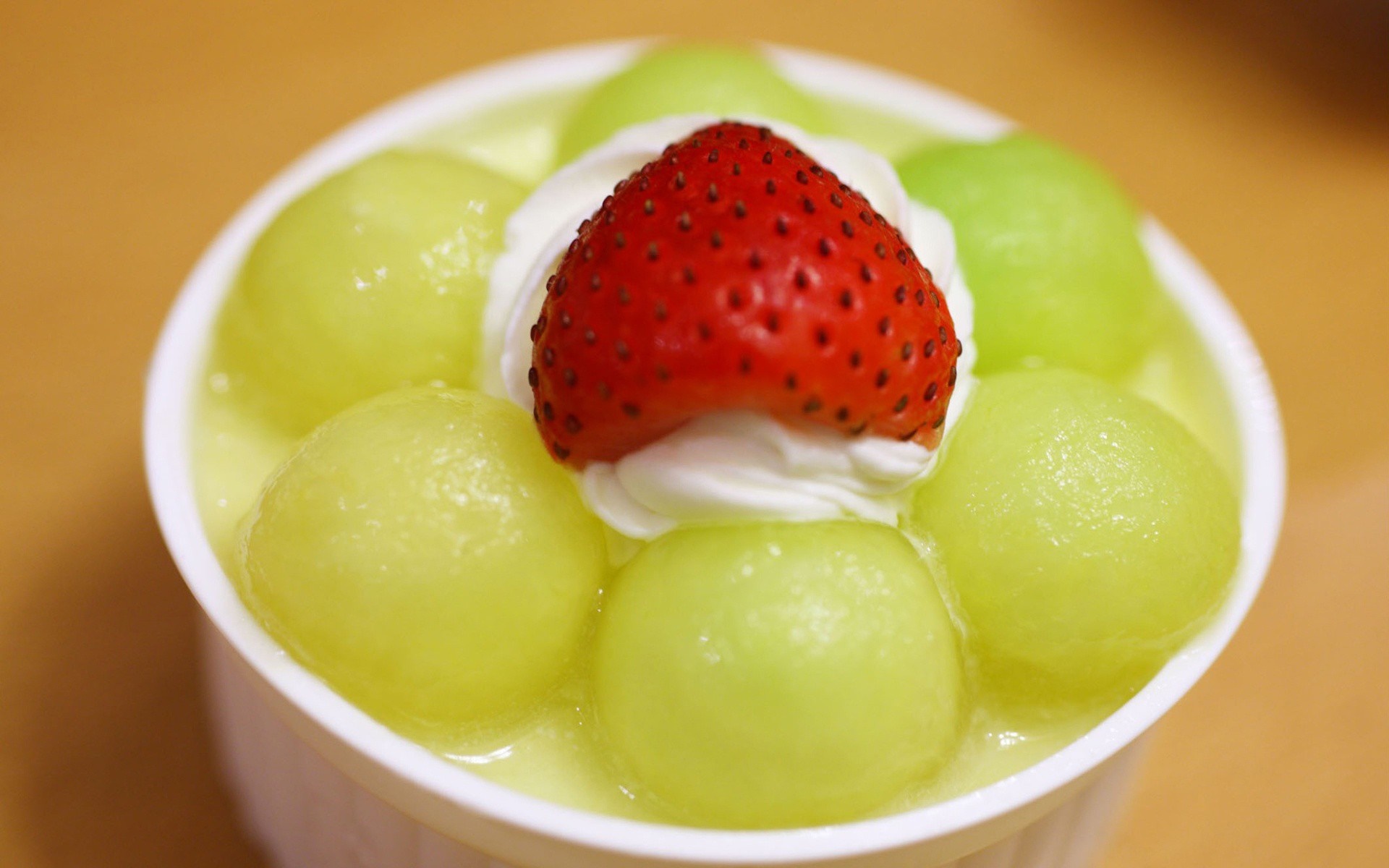 Dessert with melon balls, whipped cream, and strawberry HD Wallpaper