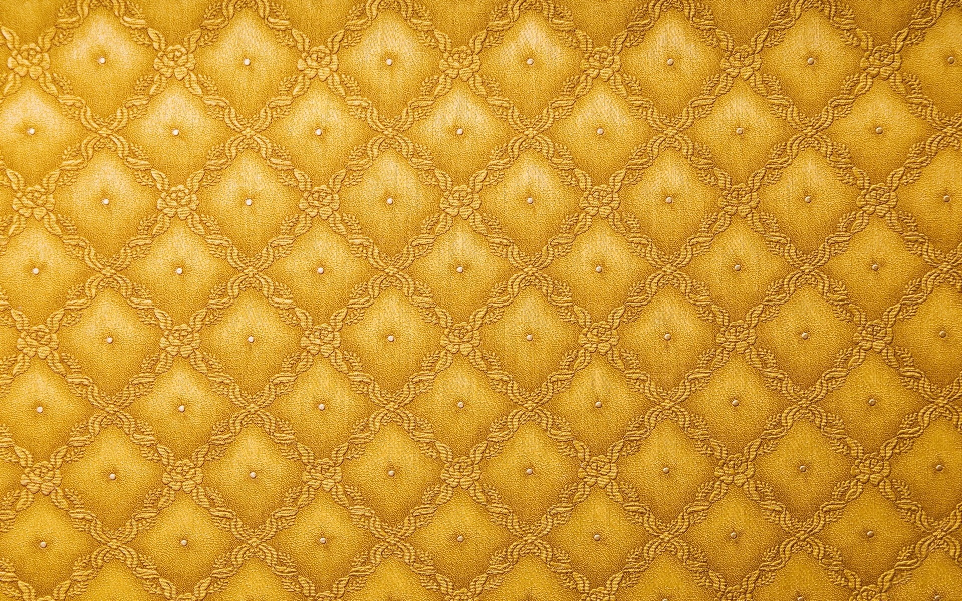 Yellow diamond pattern with floral accents and studs HD Wallpaper
