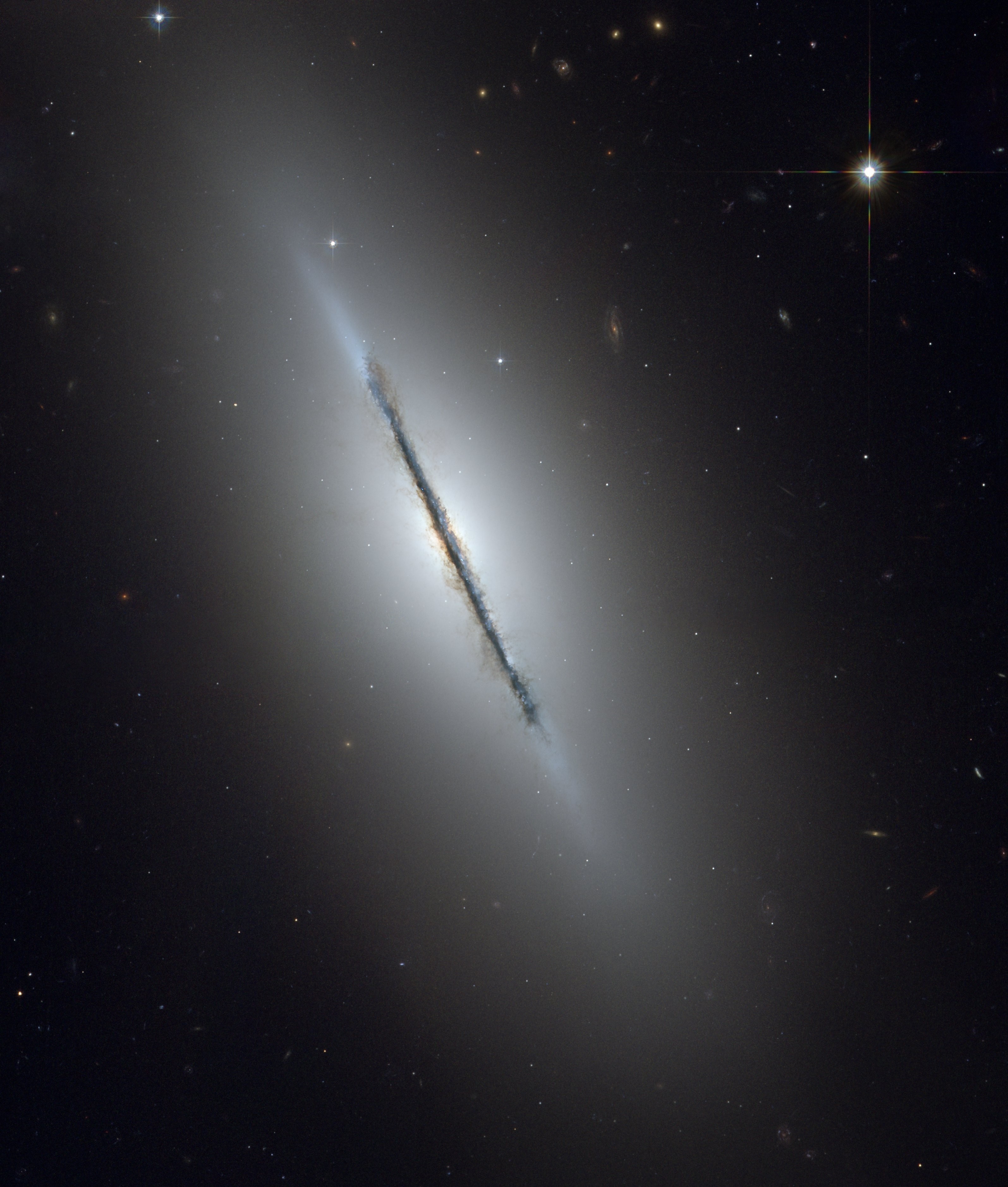 Edge-on spiral galaxy with dust lane HD Wallpaper