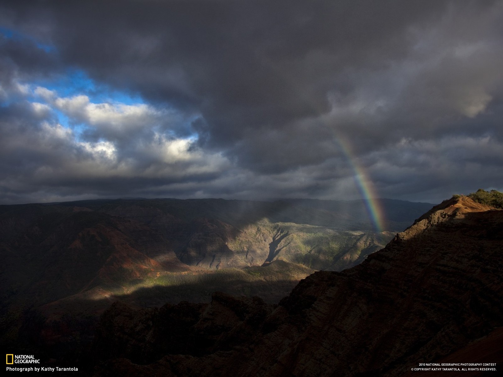 Rainbow over a canyon at sunset HD Wallpaper