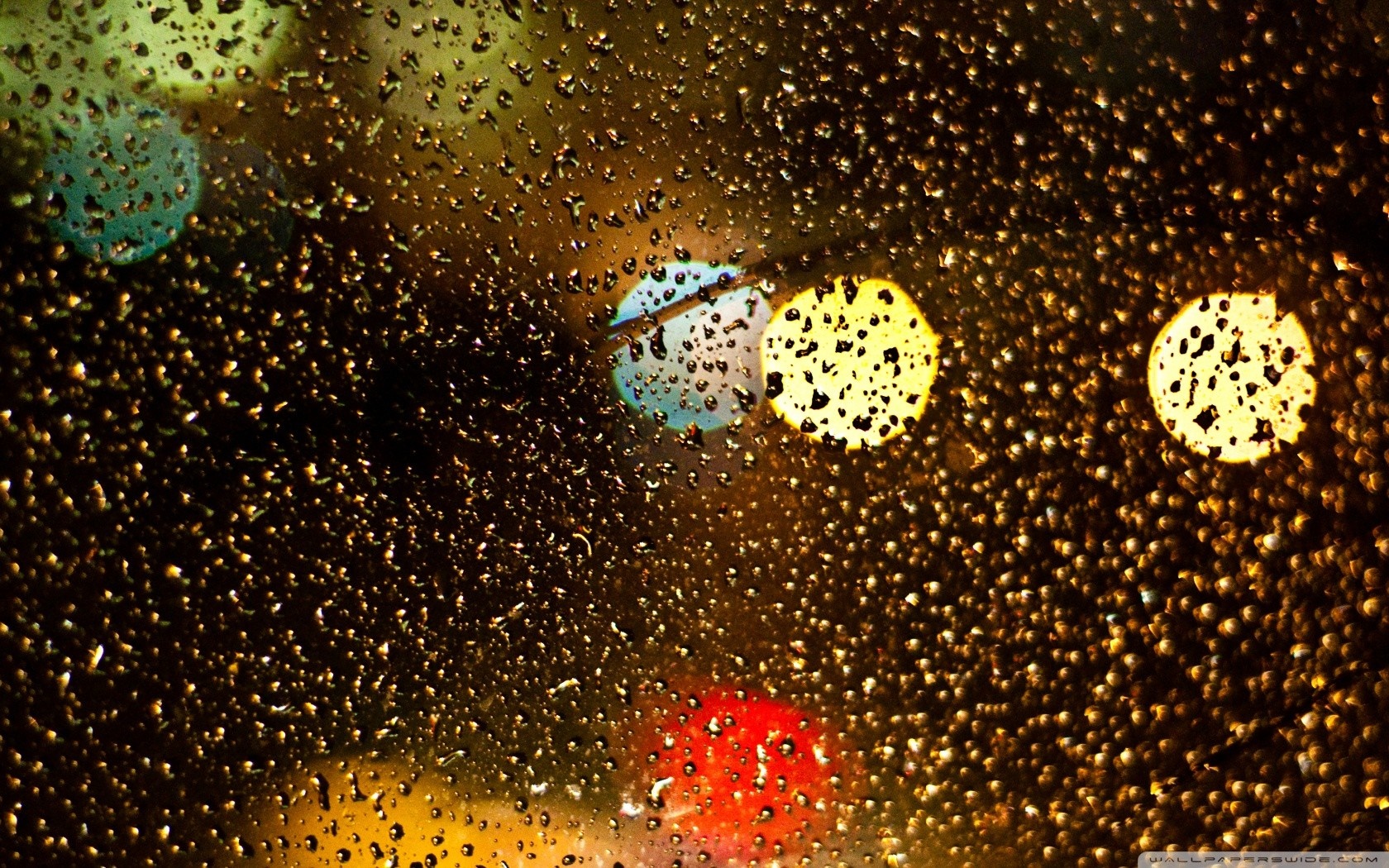 Nighttime bokeh lights on wet glass HD Wallpaper