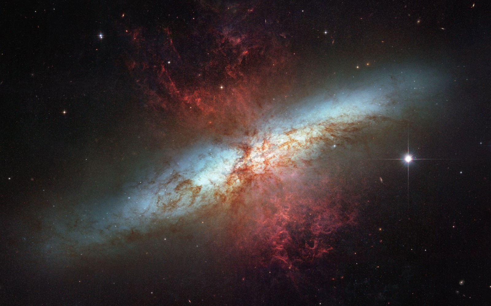 M82 galaxy with red nebula and stars HD Wallpaper