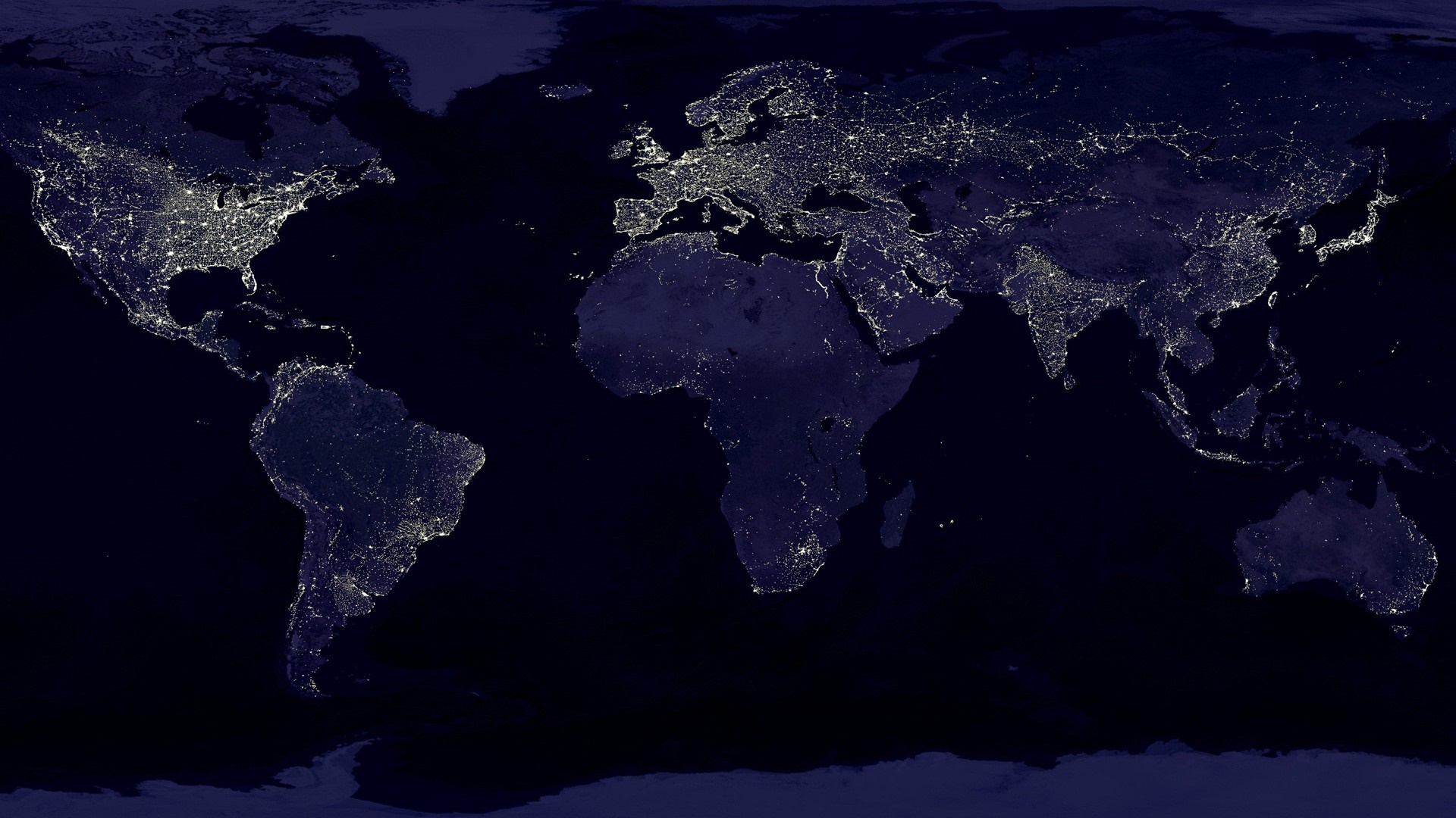 Earth at night from space showing city lights HD Wallpaper