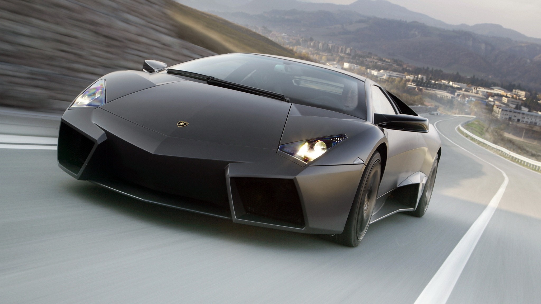 Lamborghini Reventon driving on a winding road HD Wallpaper