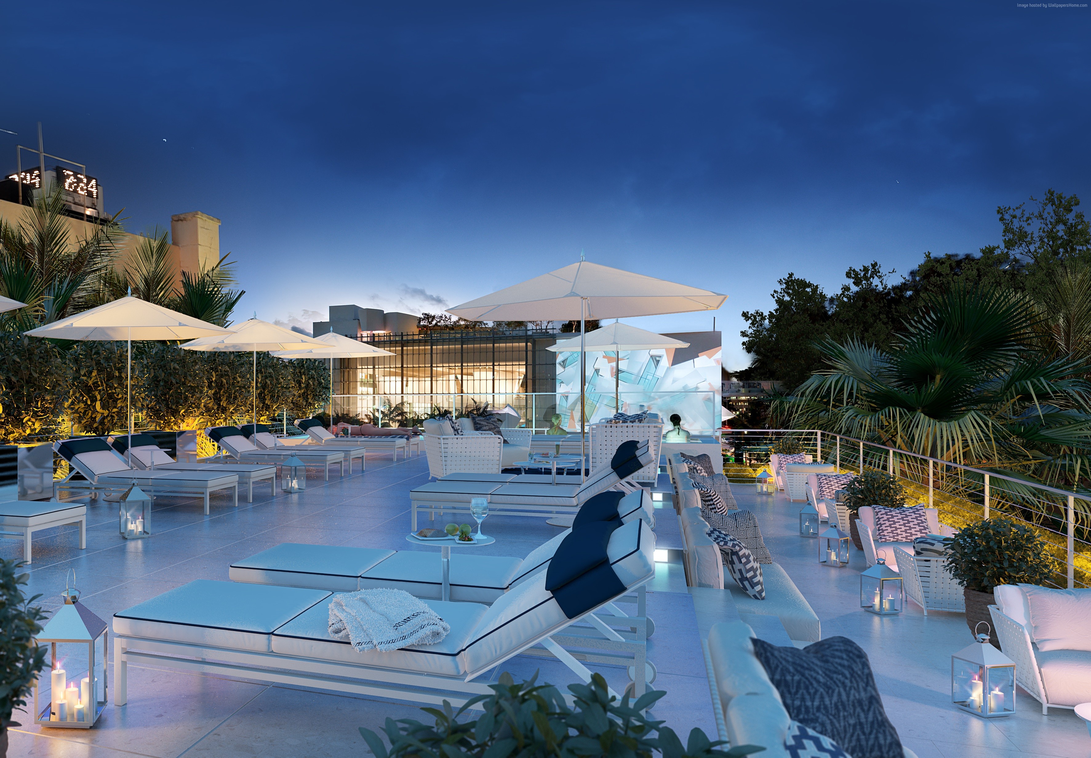 Rooftop lounge with sunbeds and umbrellas at night HD Wallpaper