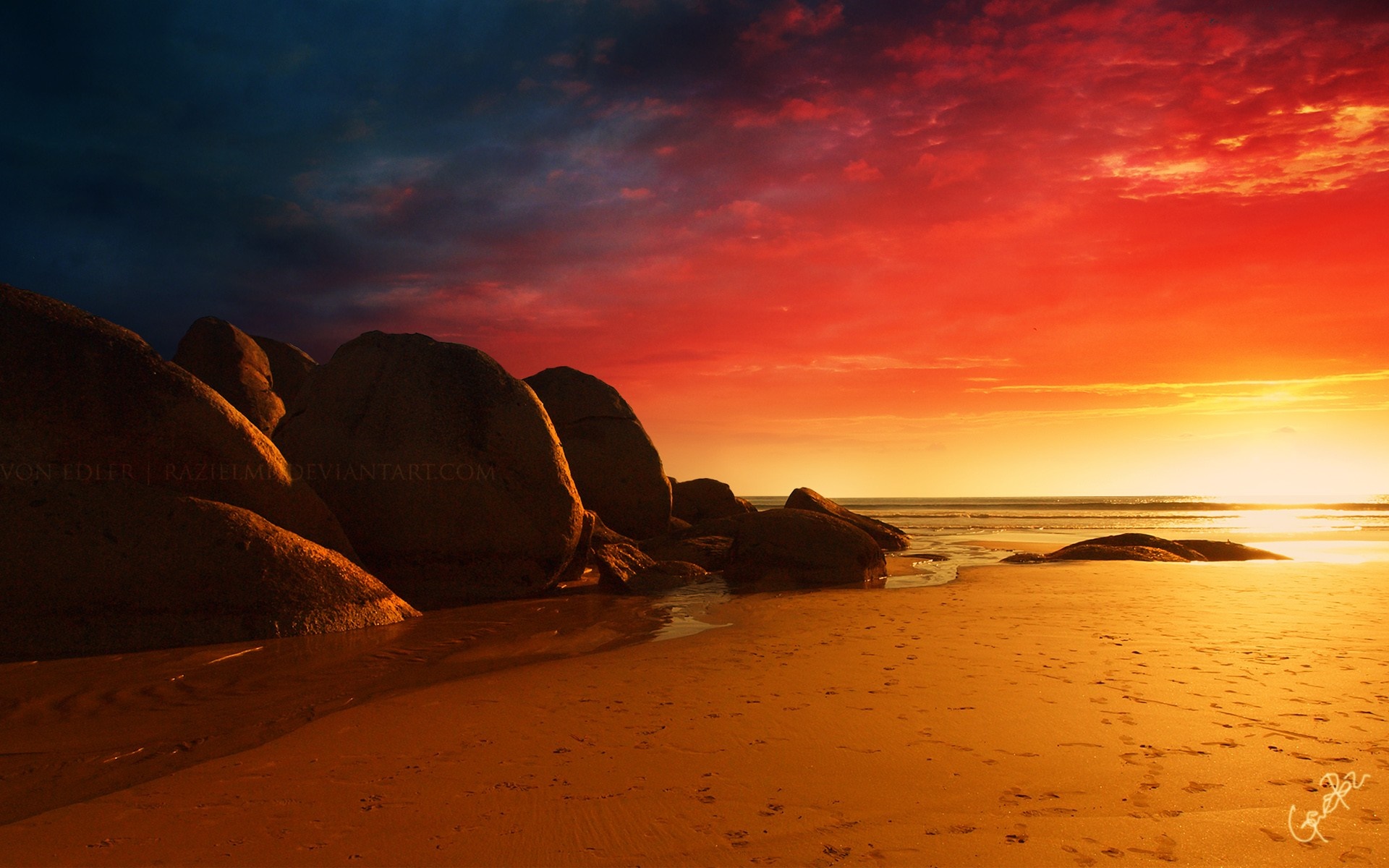 Sunset over a rocky beach with dramatic sky HD Wallpaper