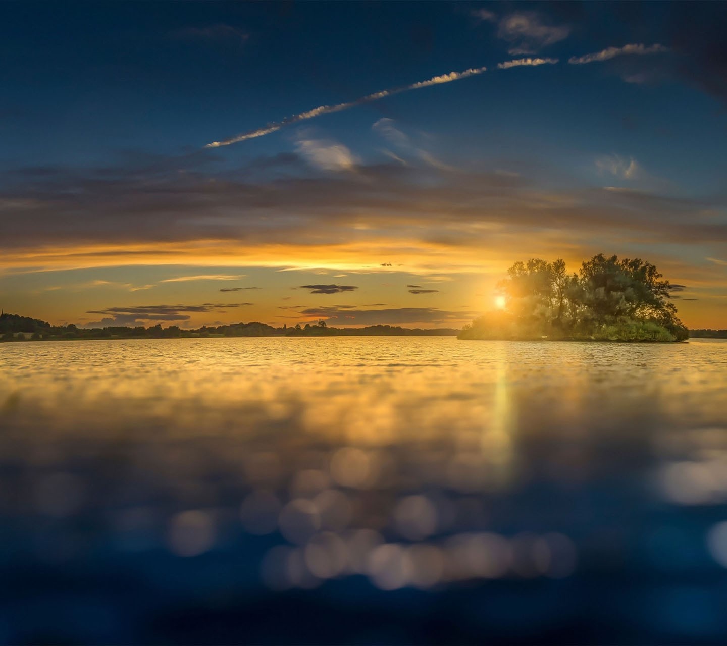 Sunset over a calm lake with an island HD Wallpaper