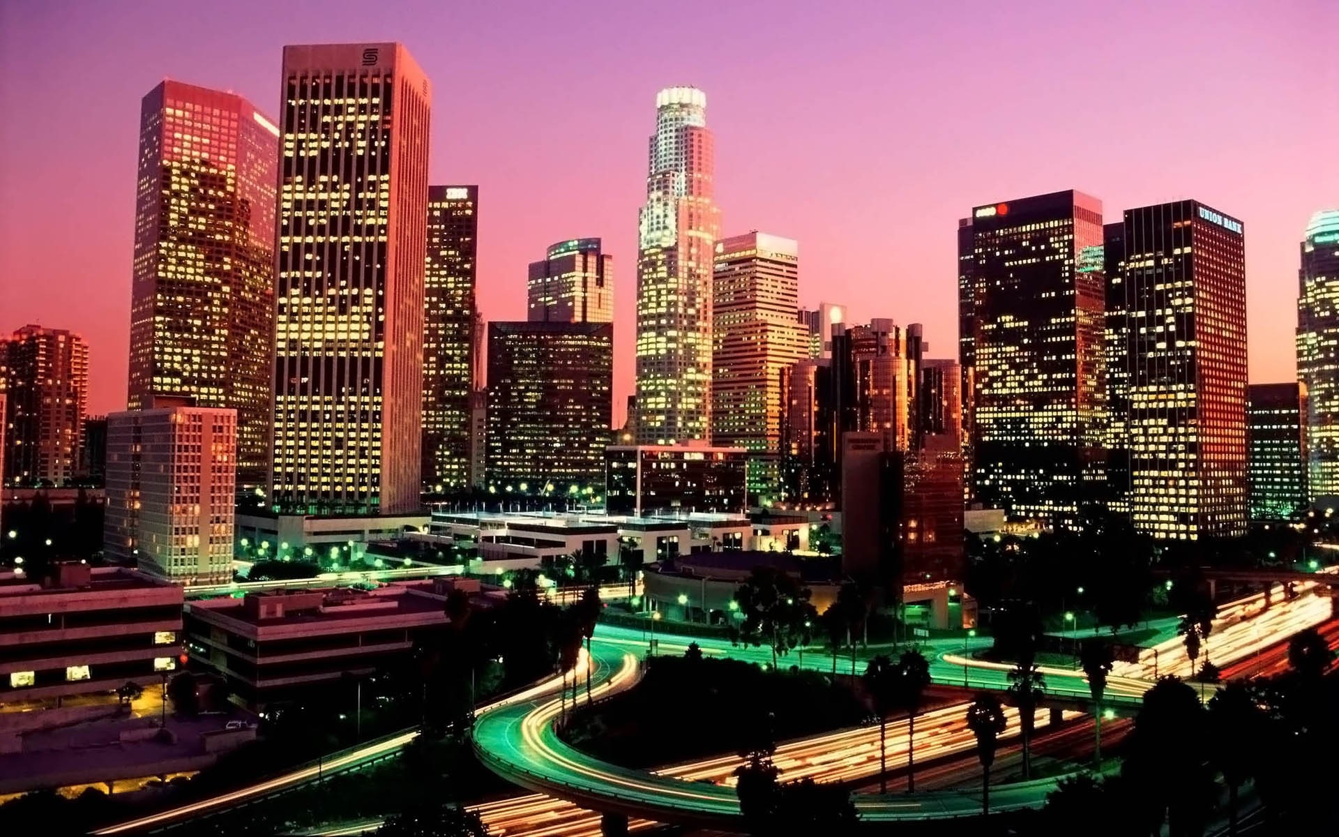 Downtown Los Angeles skyline at dusk with light trails HD Wallpaper