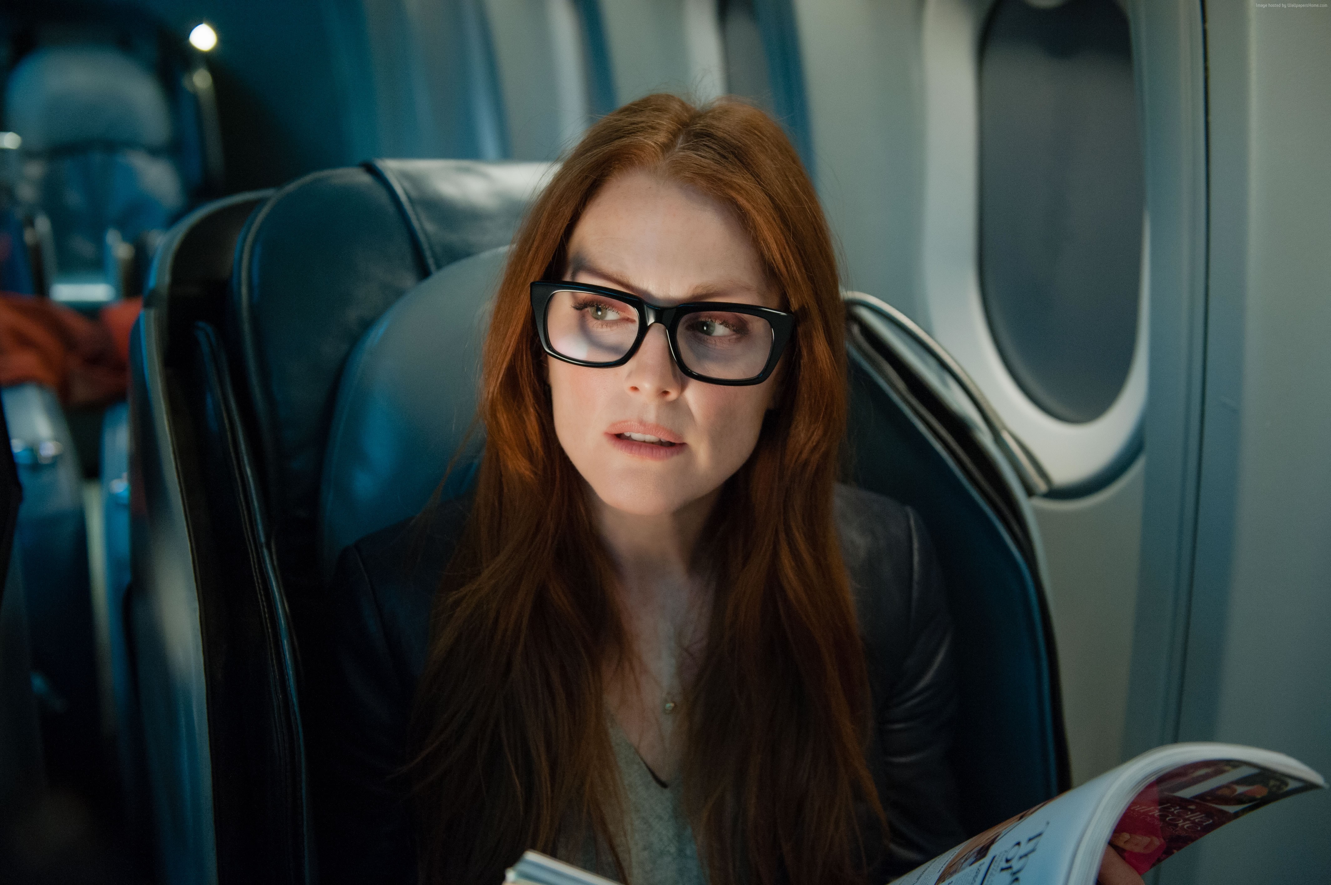 Julianne Moore wearing glasses on an airplane HD Wallpaper