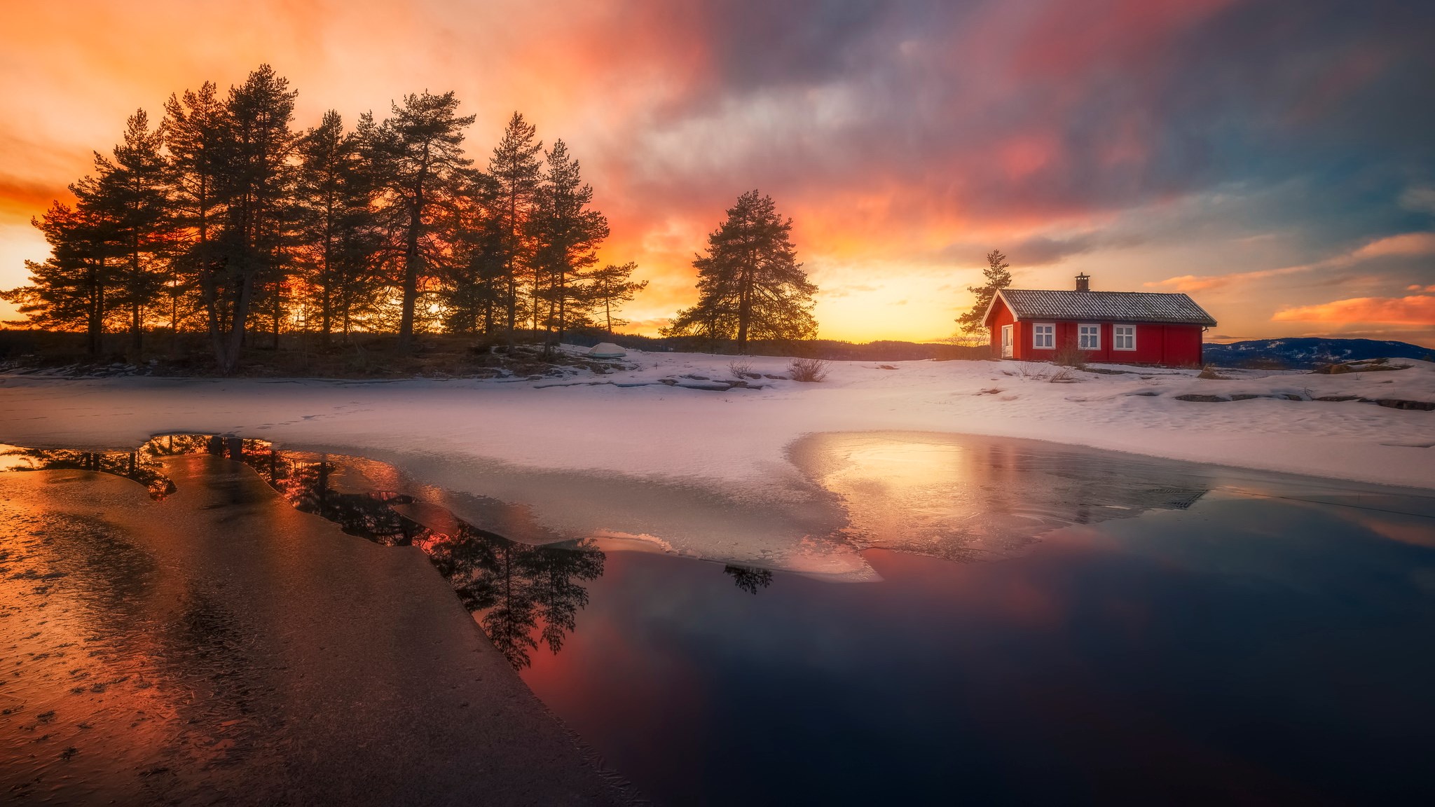 Red cabin by frozen lake at sunset HD Wallpaper