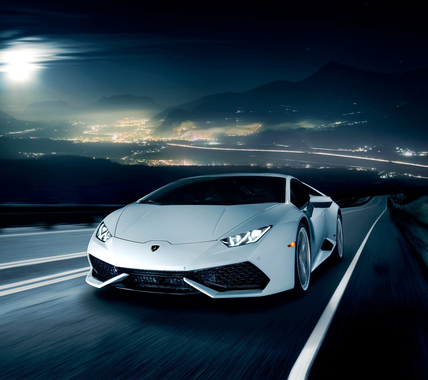 White Lamborghini Huracan driving on a mountain road at night HD Wallpaper