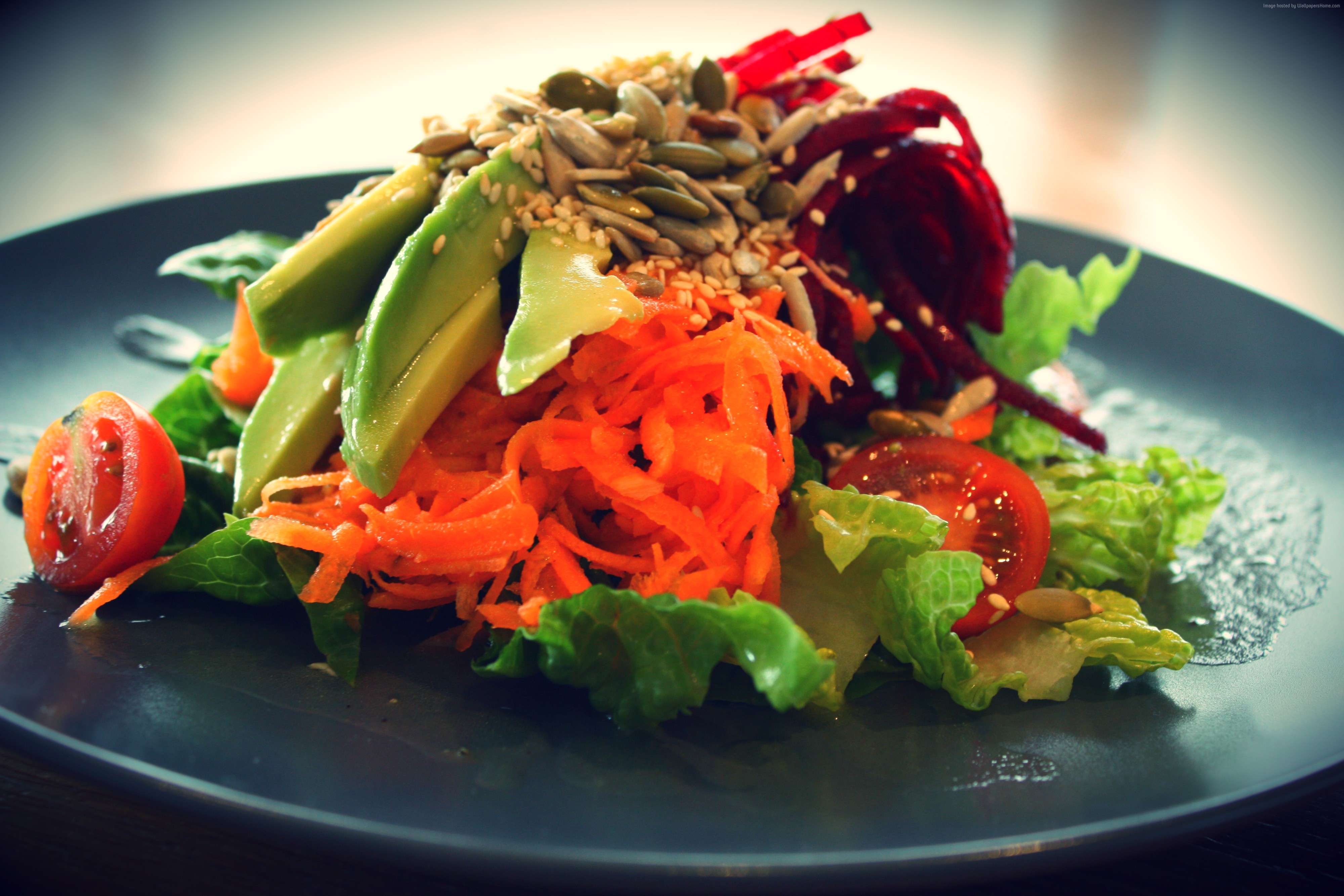 Salad with avocado, carrots, beets, tomatoes, and seeds HD Wallpaper