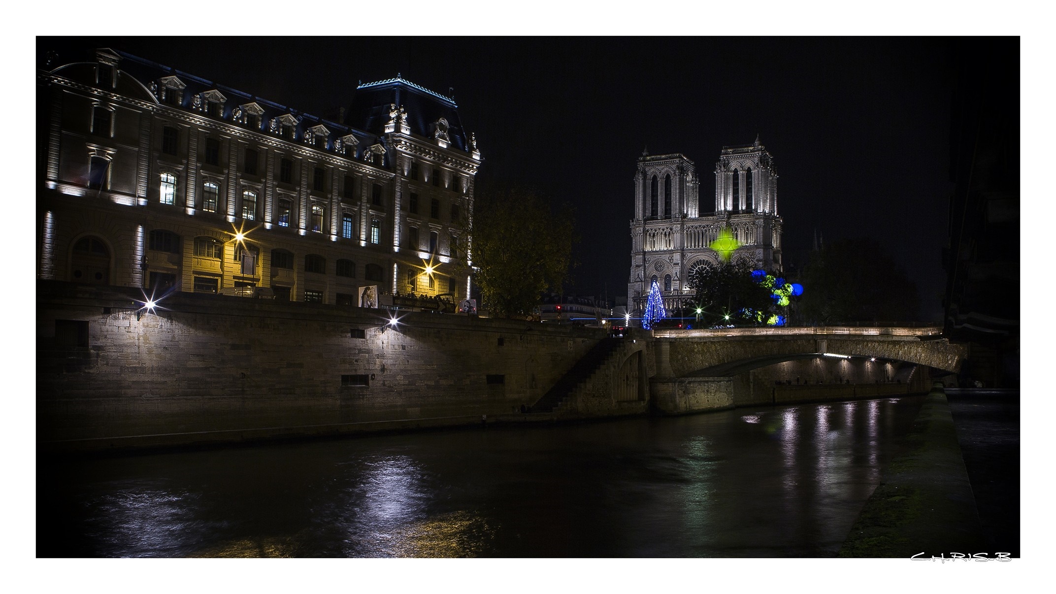 Notre Dame Cathedral and building at night over the Seine River in Paris HD Wallpaper