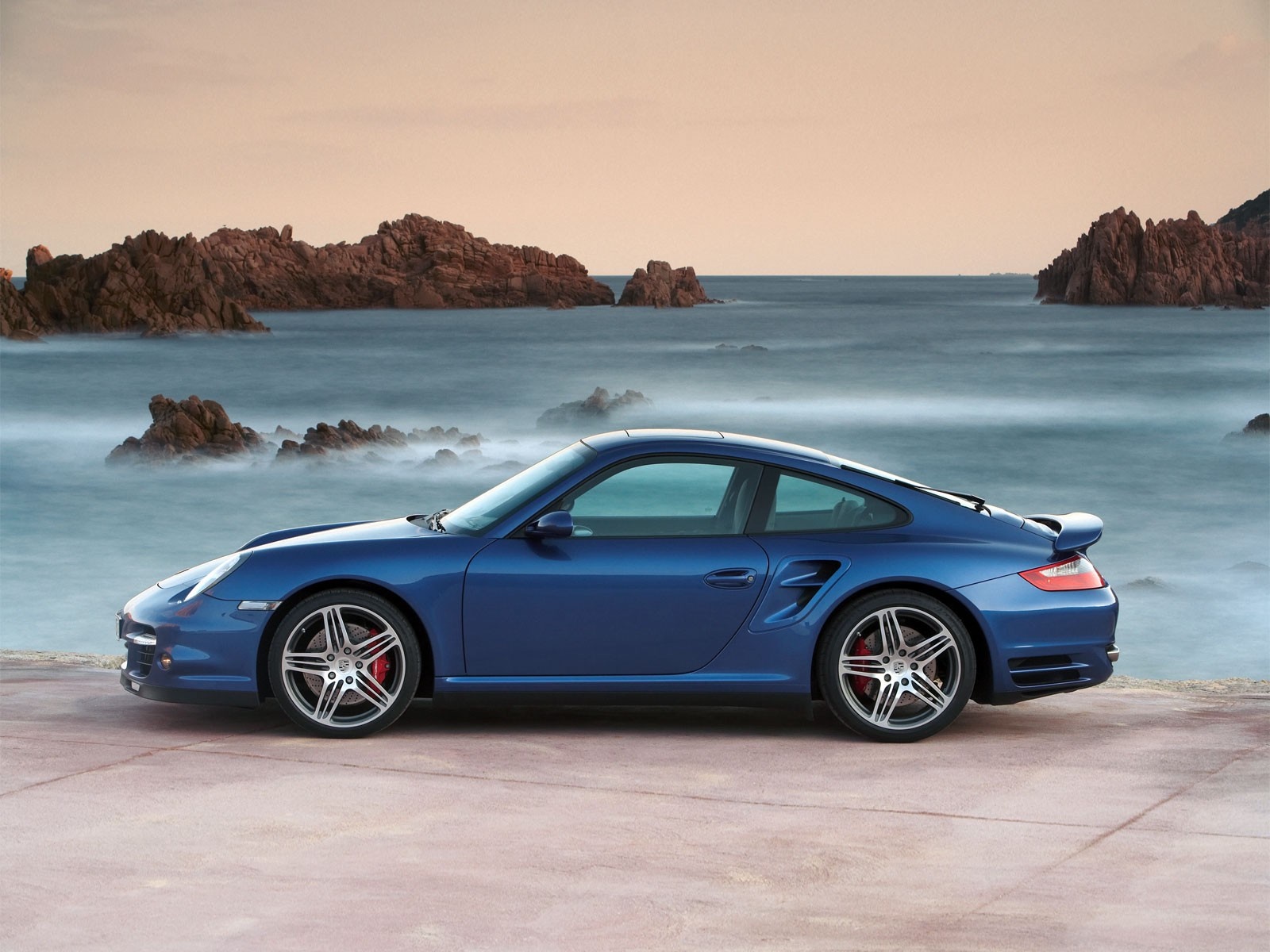 Blue Porsche 911 sports car by the sea HD Wallpaper