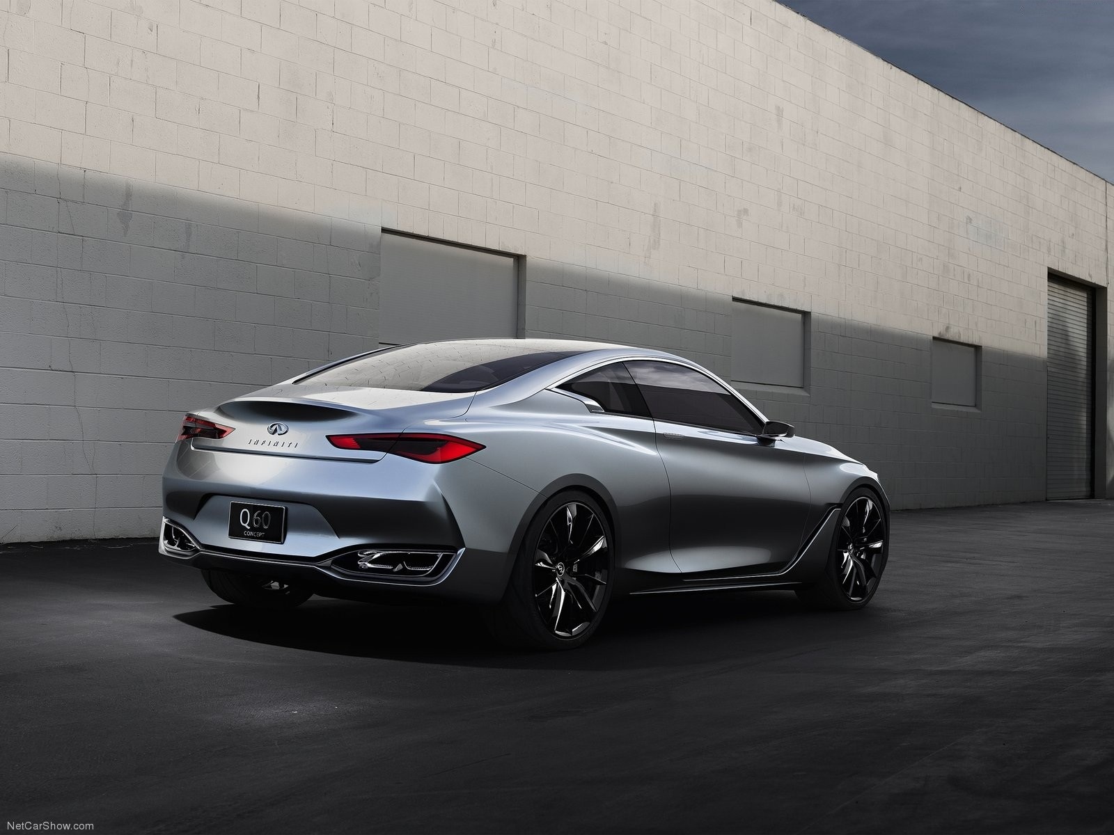Silver Infiniti Q60 Concept car parked near a brick wall HD Wallpaper