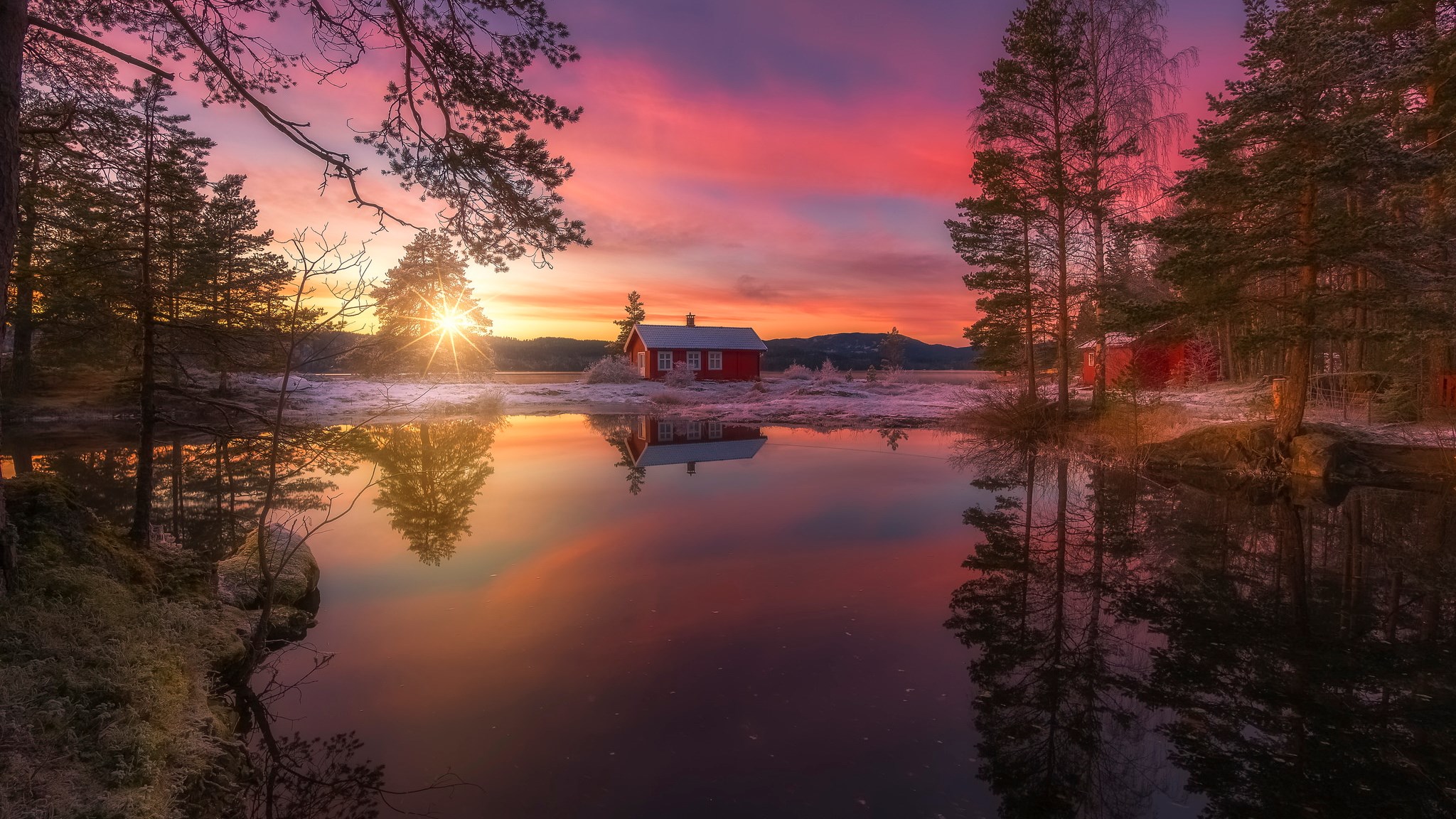 Red cabin by a lake at sunset with pine trees HD Wallpaper