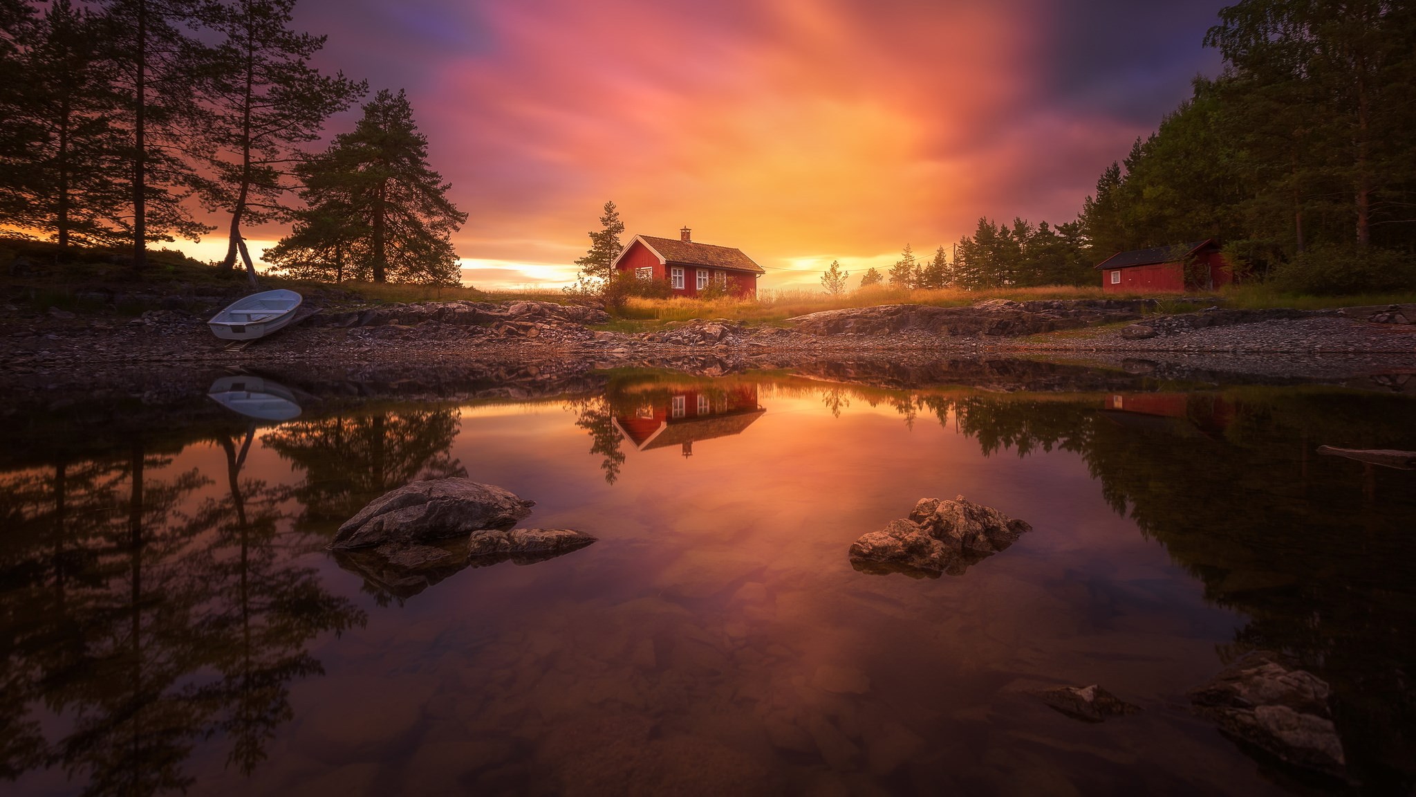 Red cabins by a lake at sunset HD Wallpaper