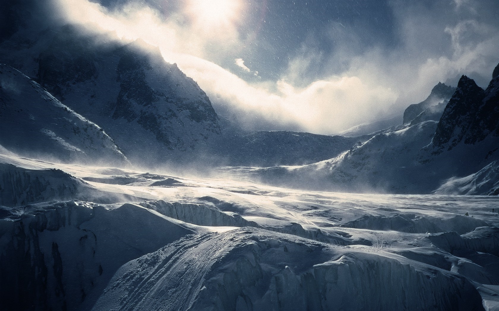 Snowy mountain range with sunlight and clouds HD Wallpaper