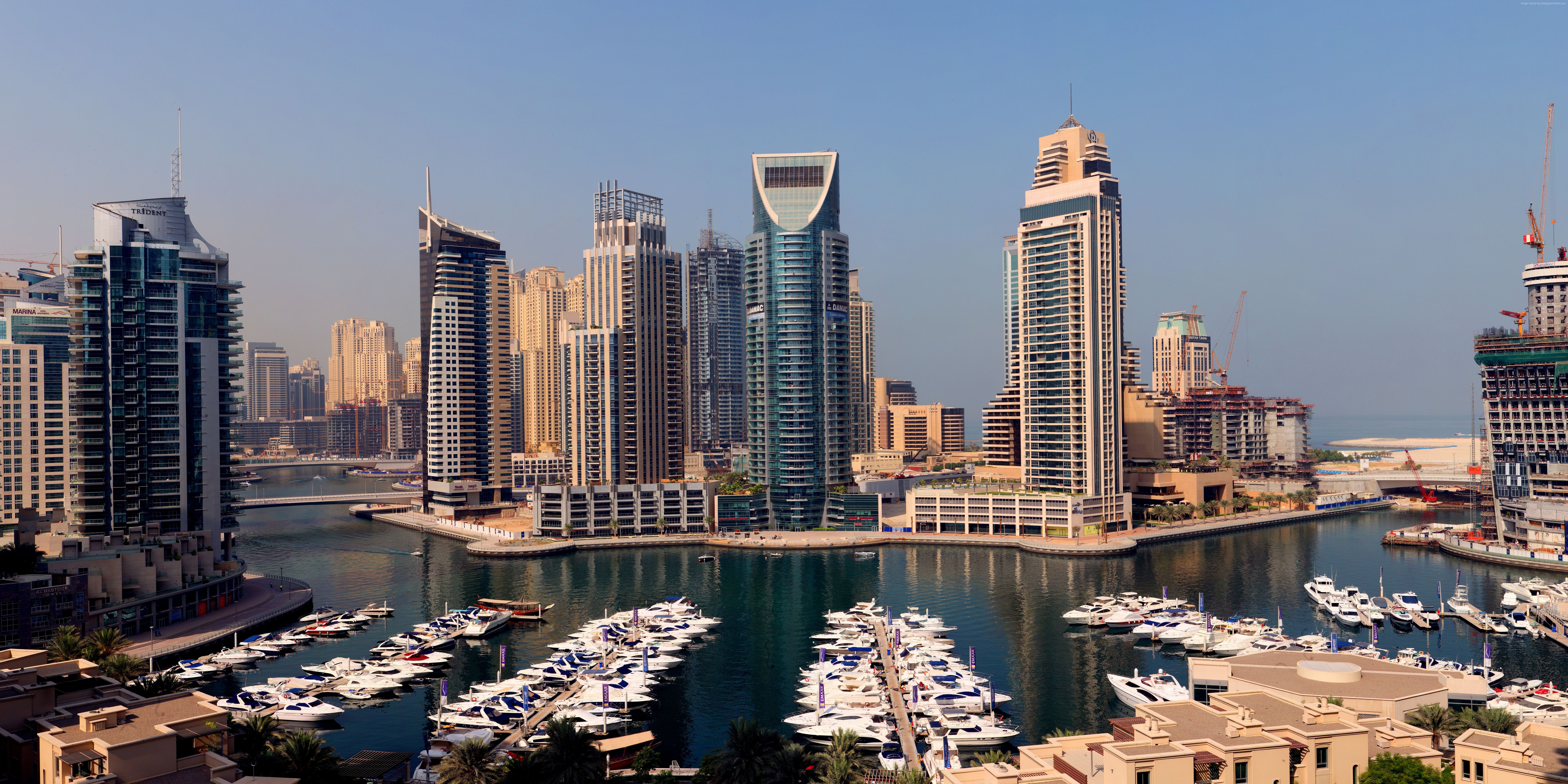 Dubai Marina skyscrapers and boats on the water HD Wallpaper