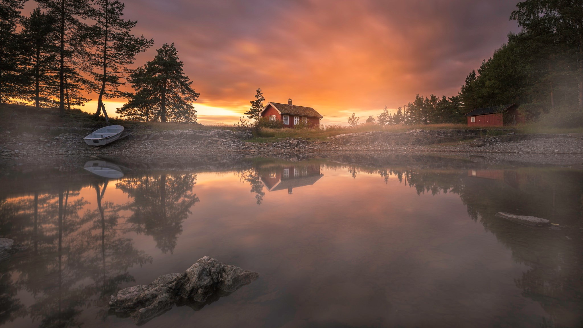 Red cabin by a misty lake at sunset HD Wallpaper