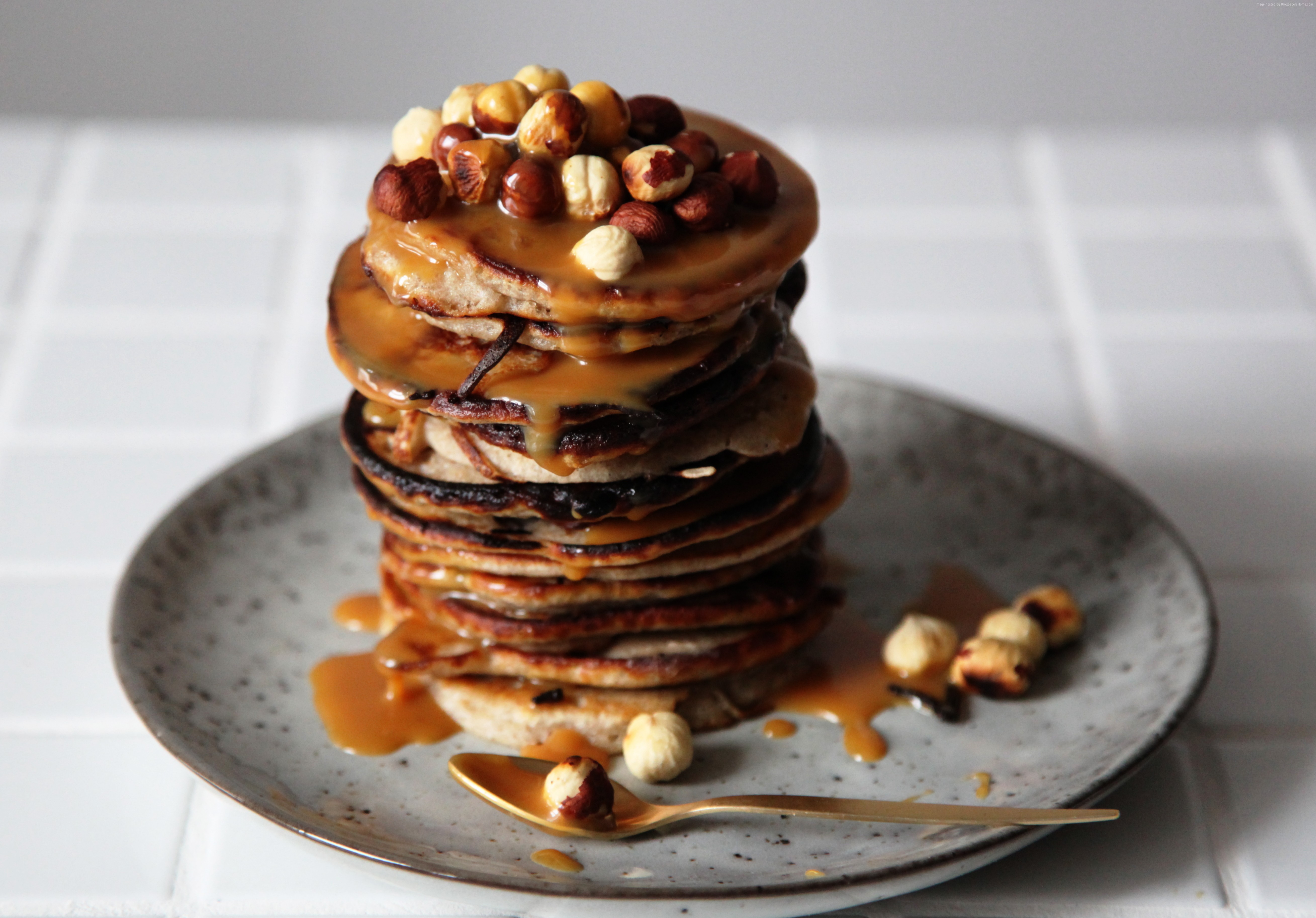 Stack of pancakes with caramel and hazelnuts HD Wallpaper