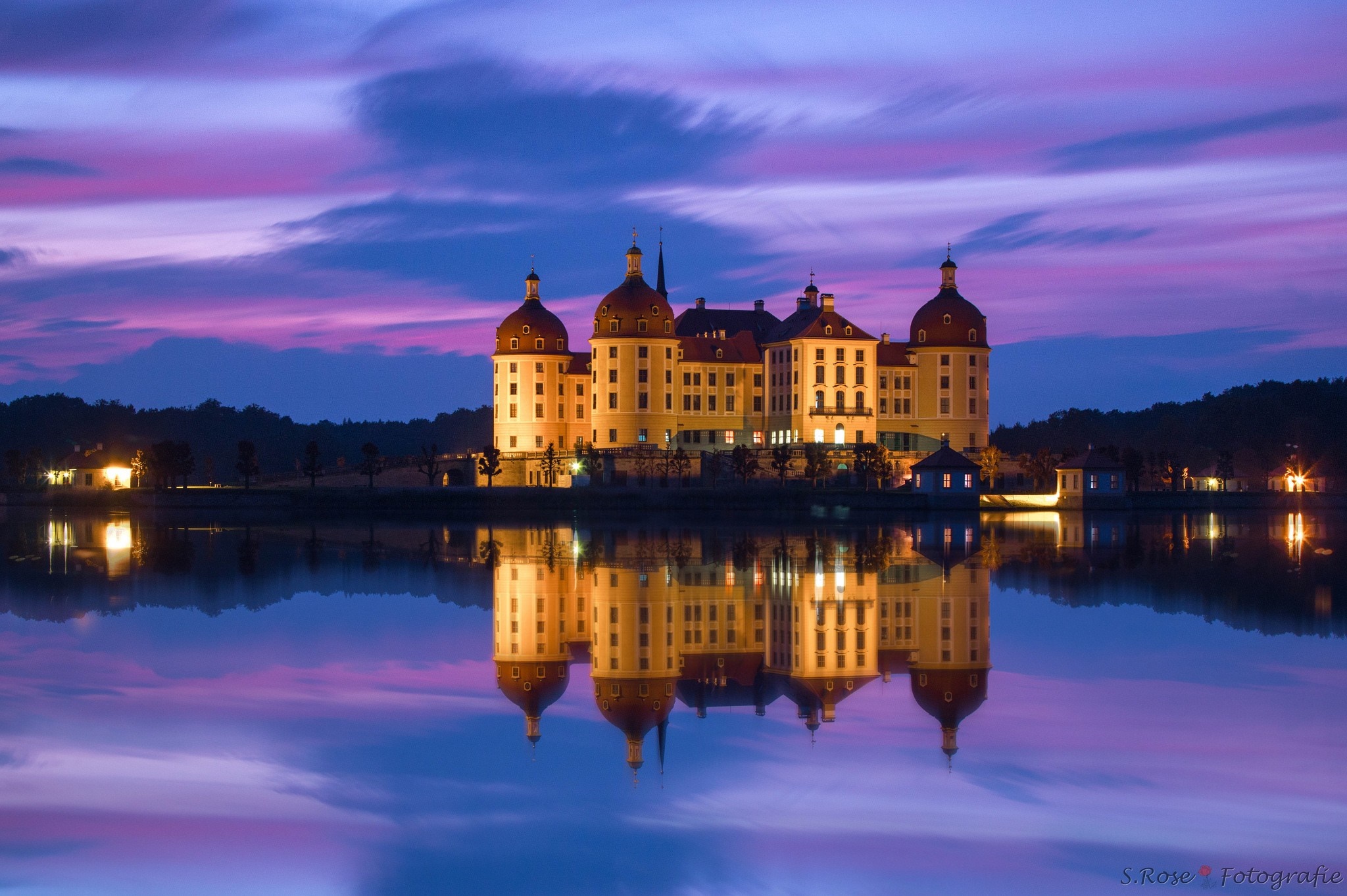 Castle reflection in lake at dusk with colorful sky HD Wallpaper