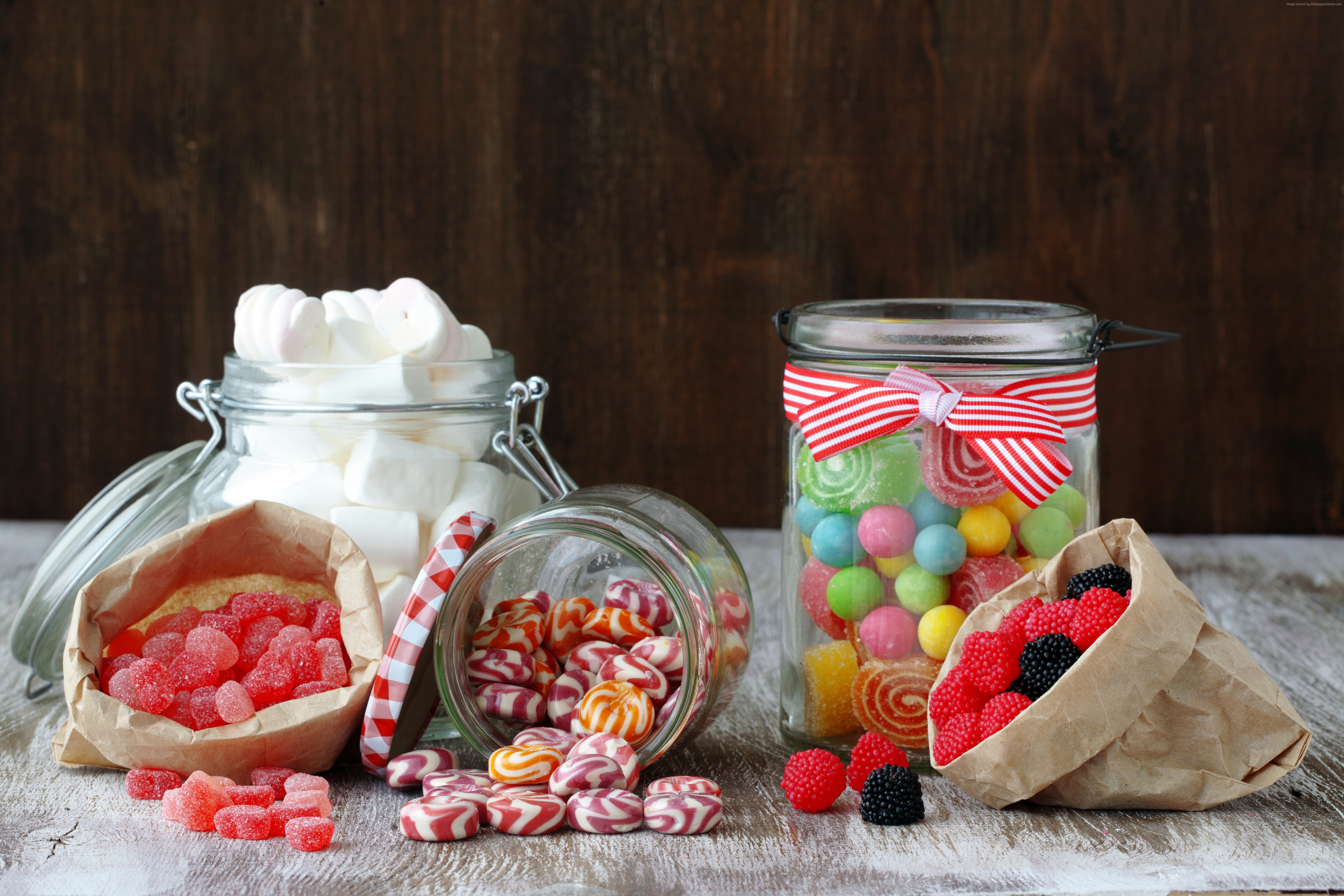 Jars and bags of assorted candies and marshmallows HD Wallpaper