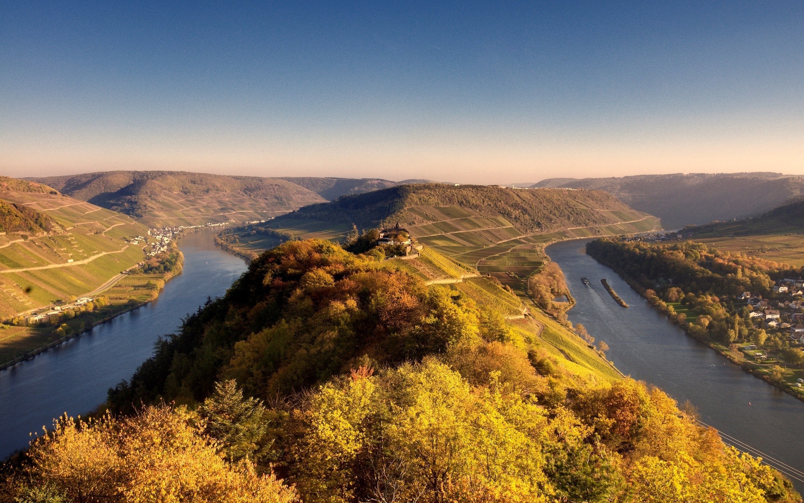 River valley with vineyards and trees in autumn HD Wallpaper