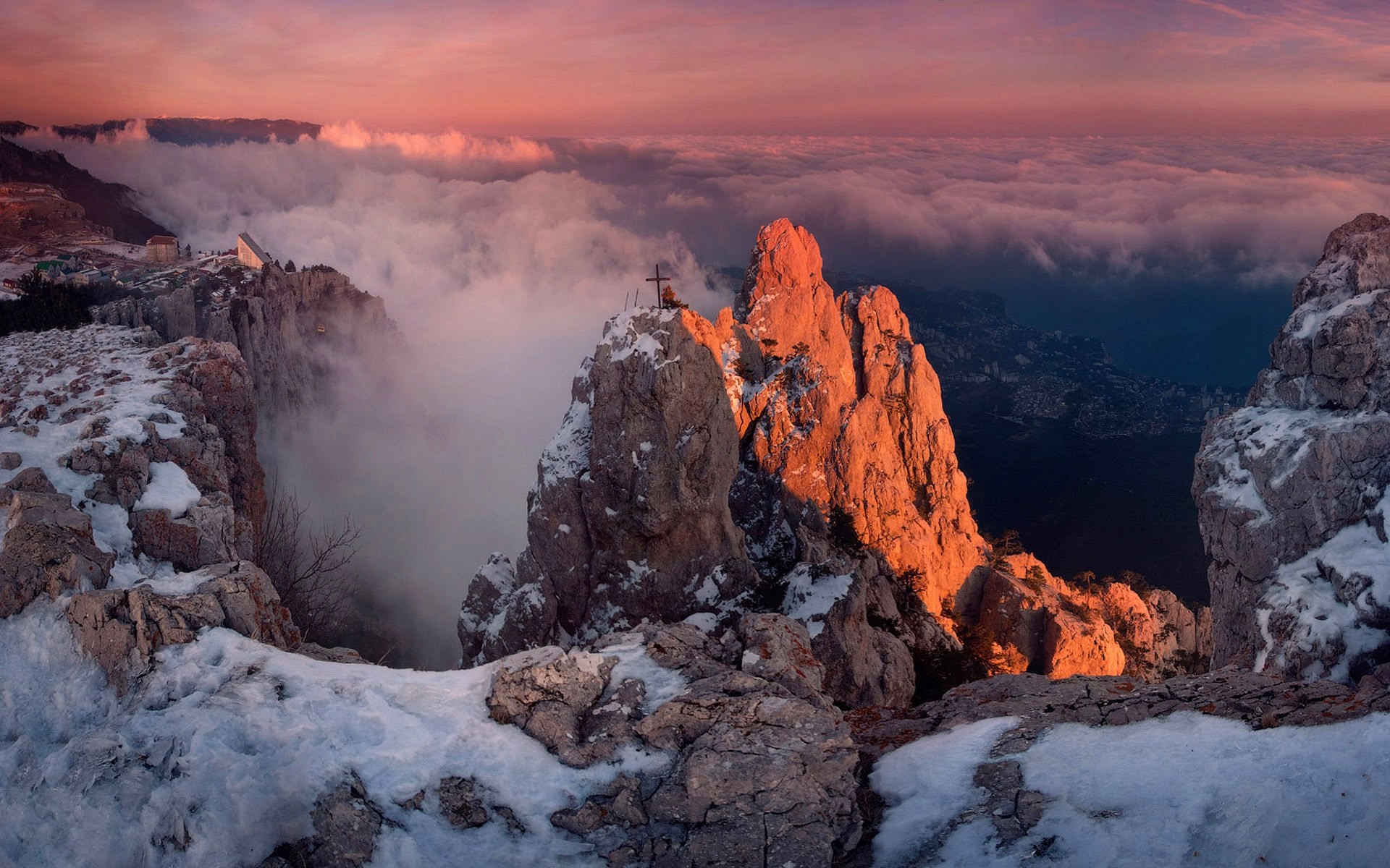 Mountain peaks at sunset with clouds and snow HD Wallpaper
