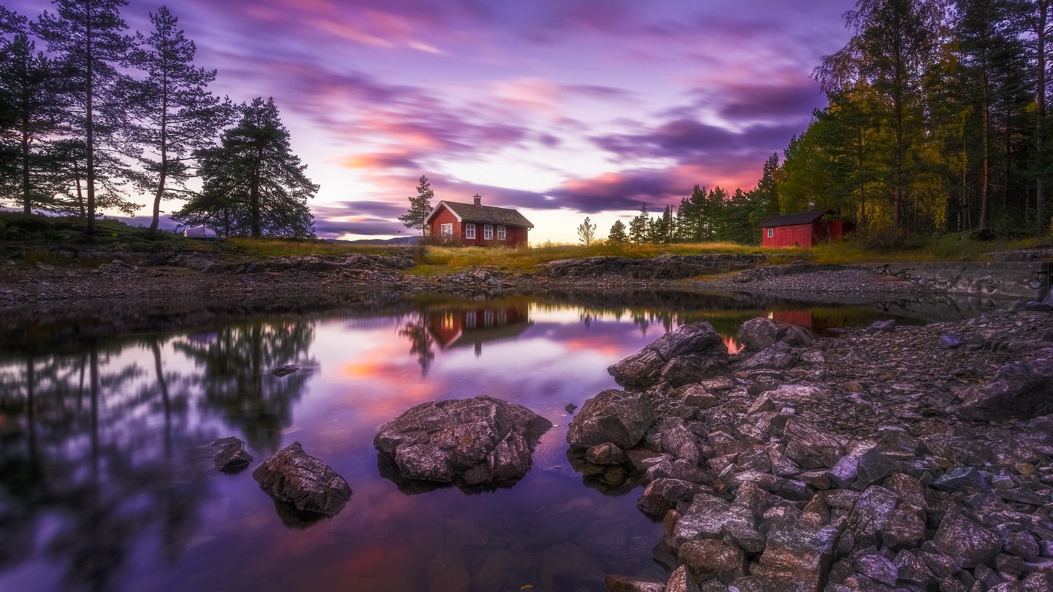 Red cabins by a lake at sunset HD Wallpaper