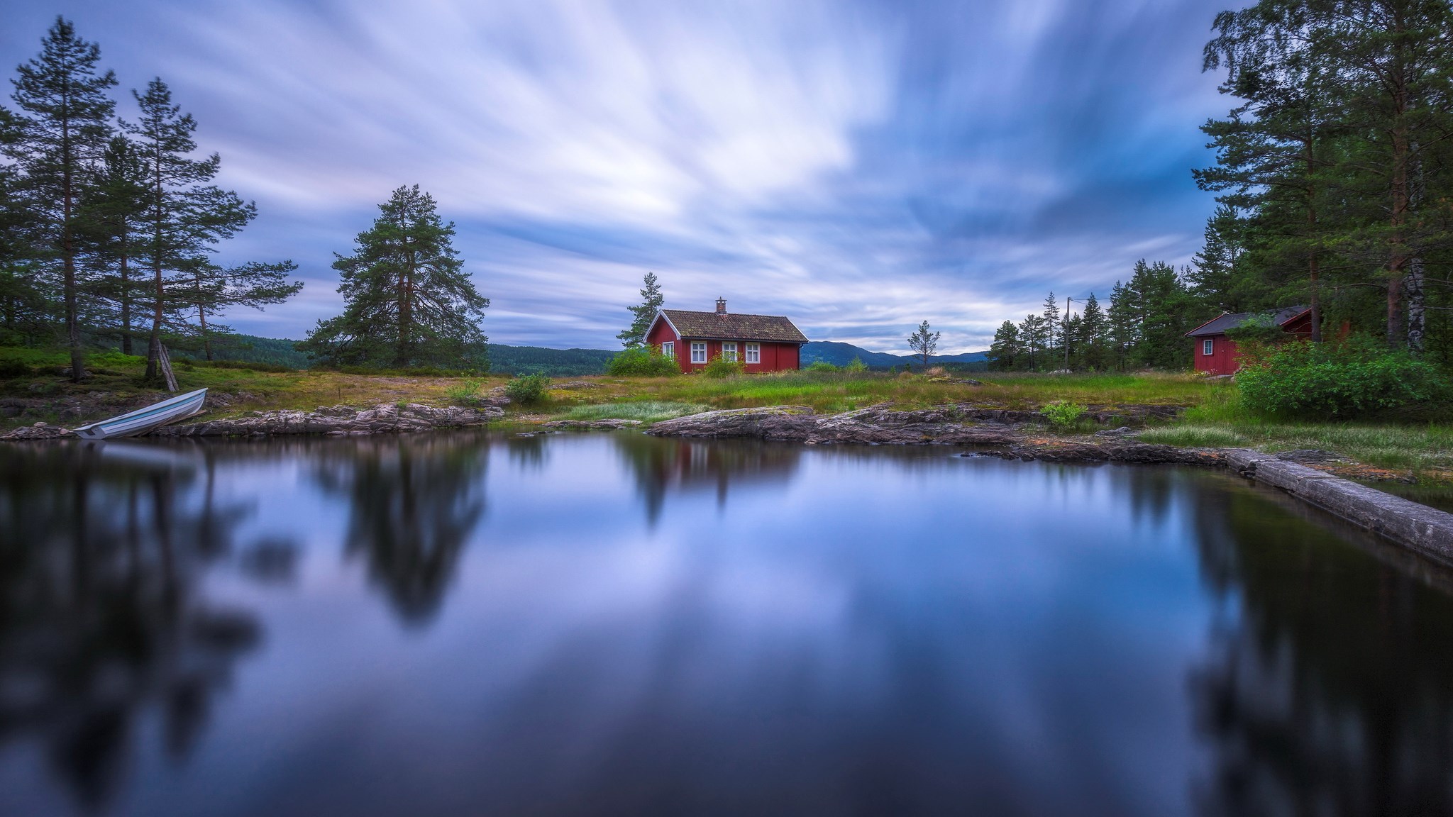 Red cabin by a lake with a boat and trees HD Wallpaper