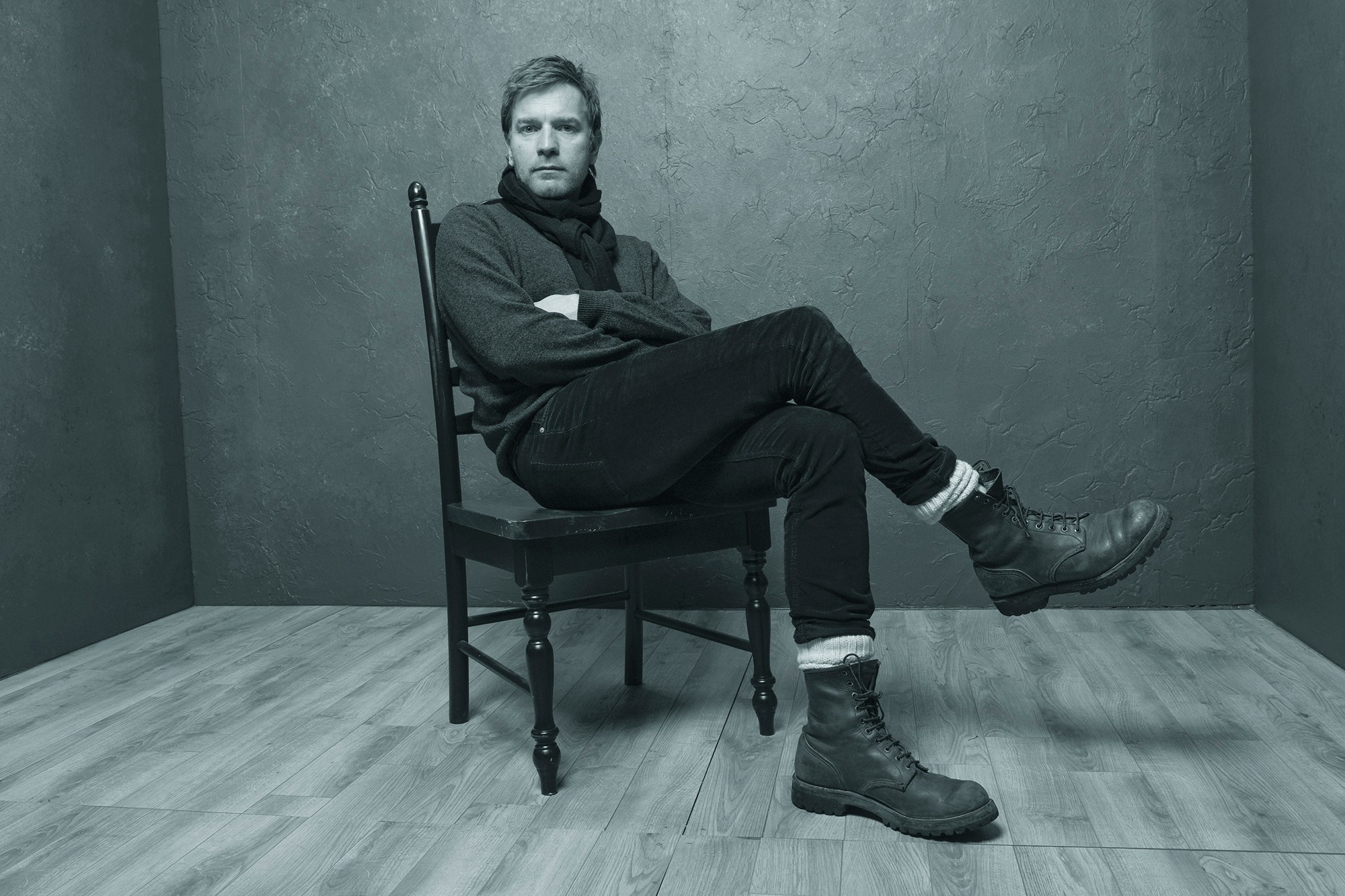 Ewan McGregor sitting on a chair HD Wallpaper