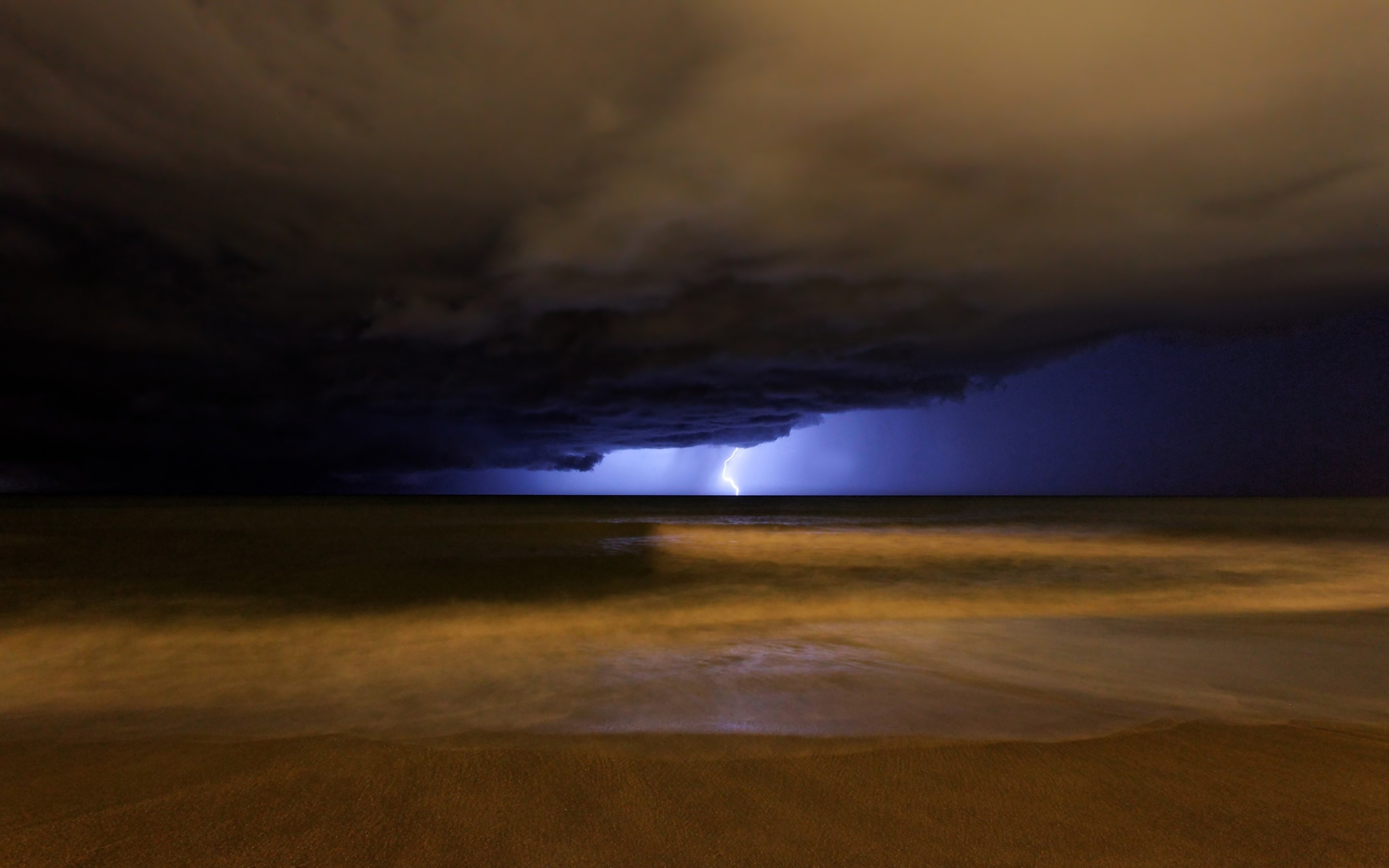 Lightning strike over the ocean at night HD Wallpaper