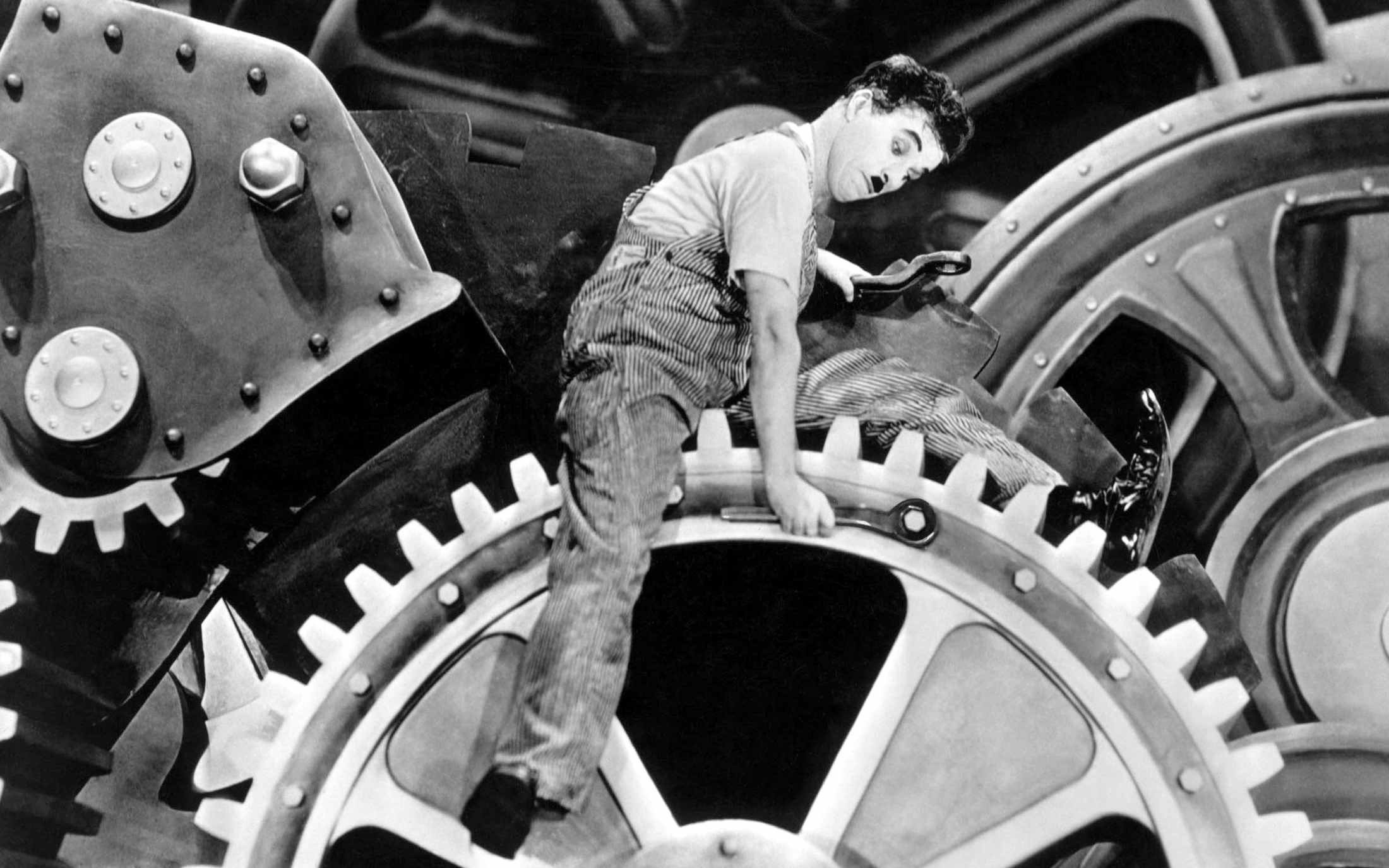 Charlie Chaplin in Modern Times on gears HD Wallpaper