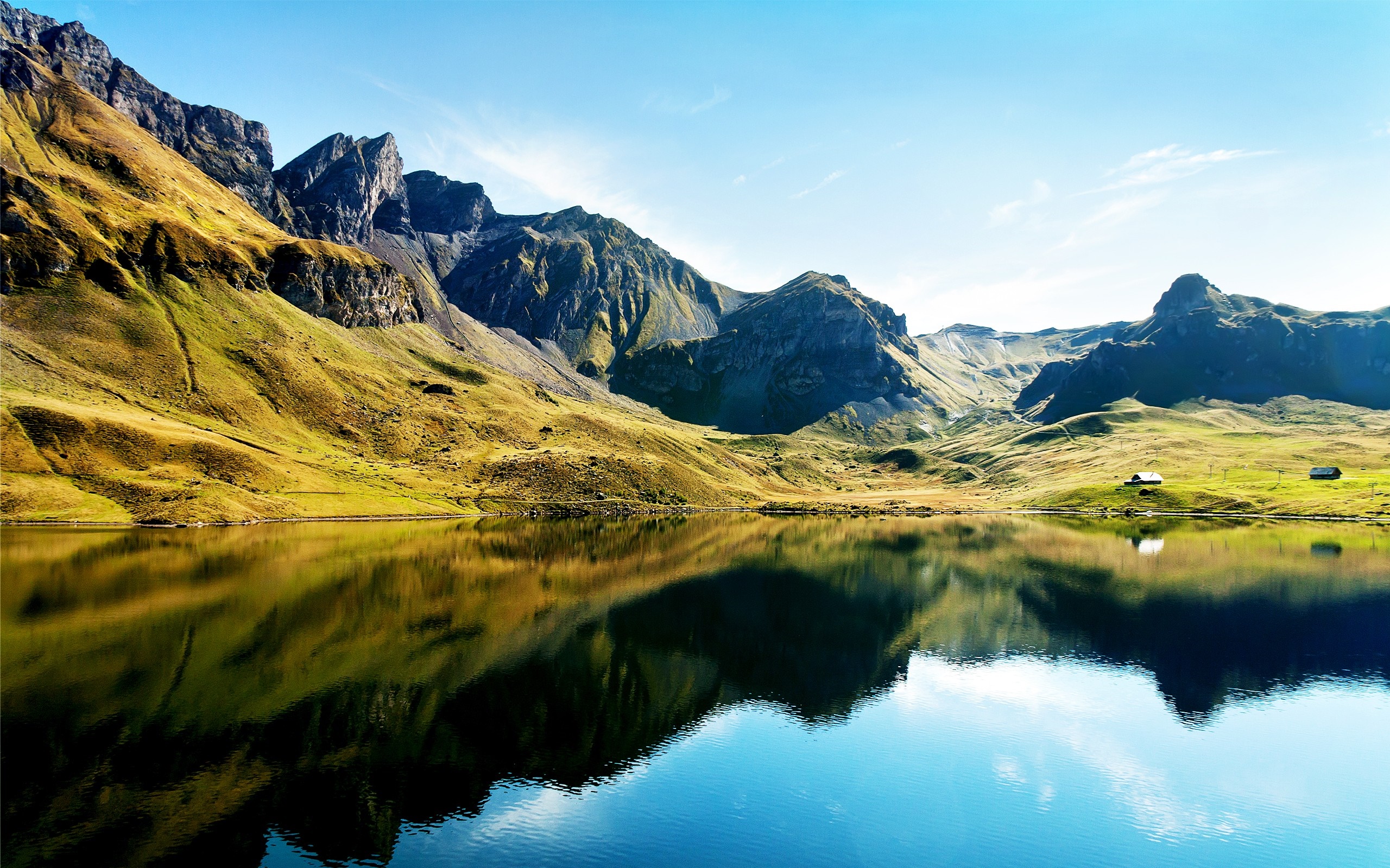 Mountain lake reflection with small houses HD Wallpaper