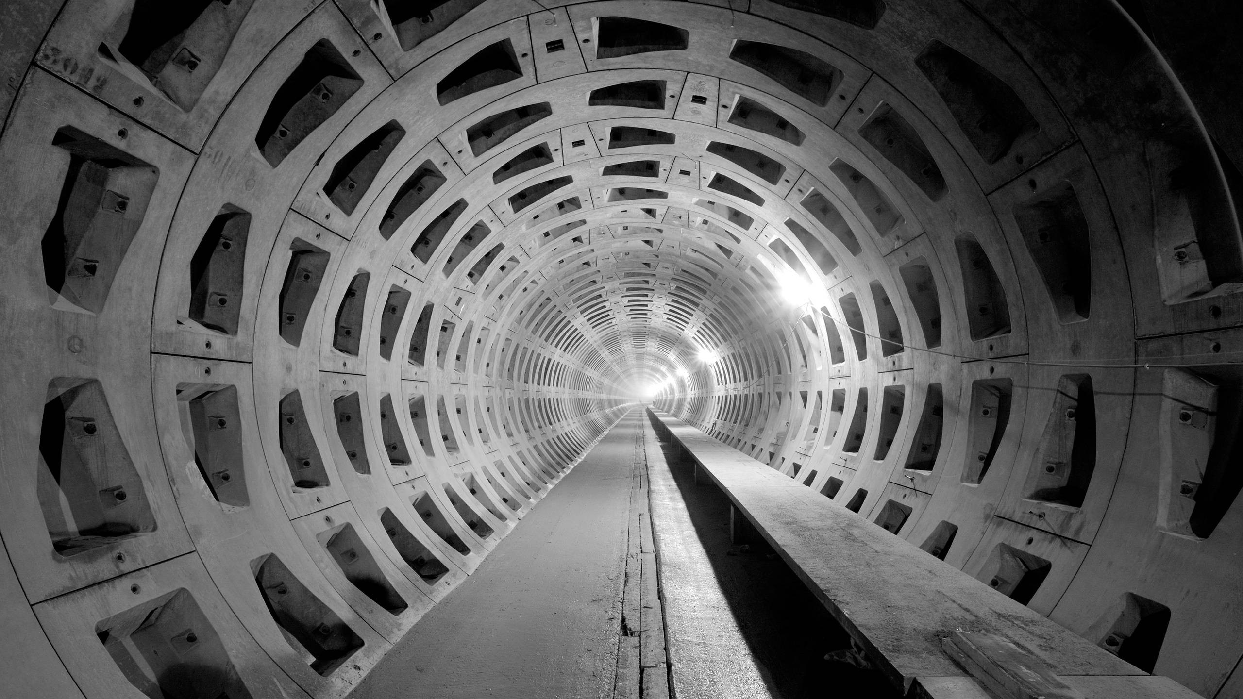 Monochrome tunnel architecture with repeating circular patterns HD Wallpaper