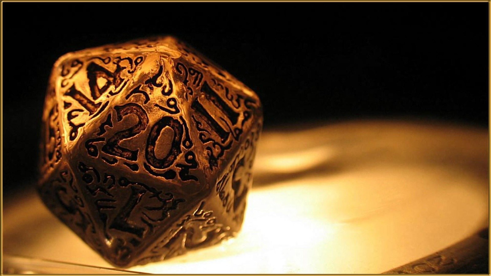 Close-up of an ornate, golden 20-sided die HD Wallpaper