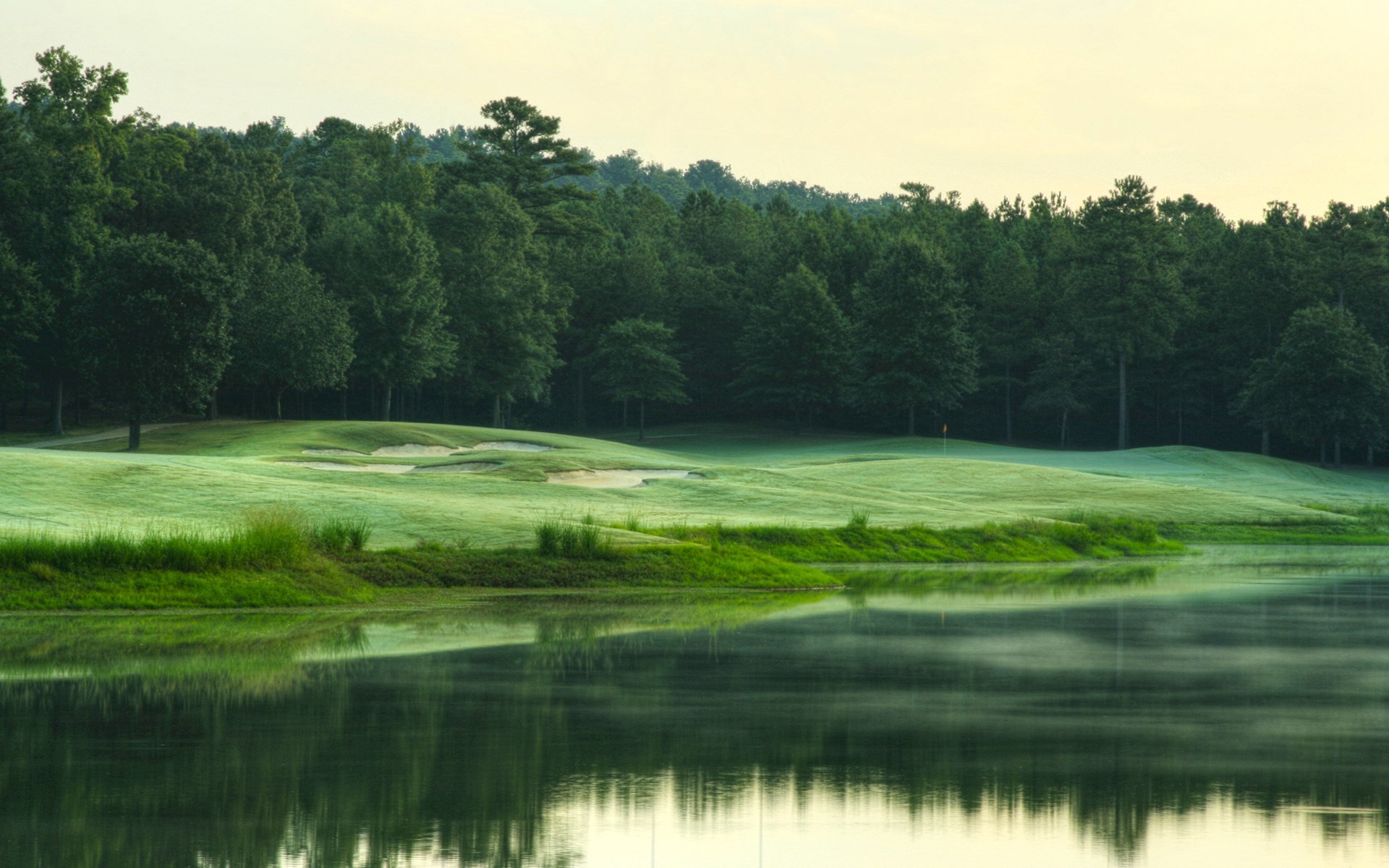 Golf course with a lake and forest HD Wallpaper