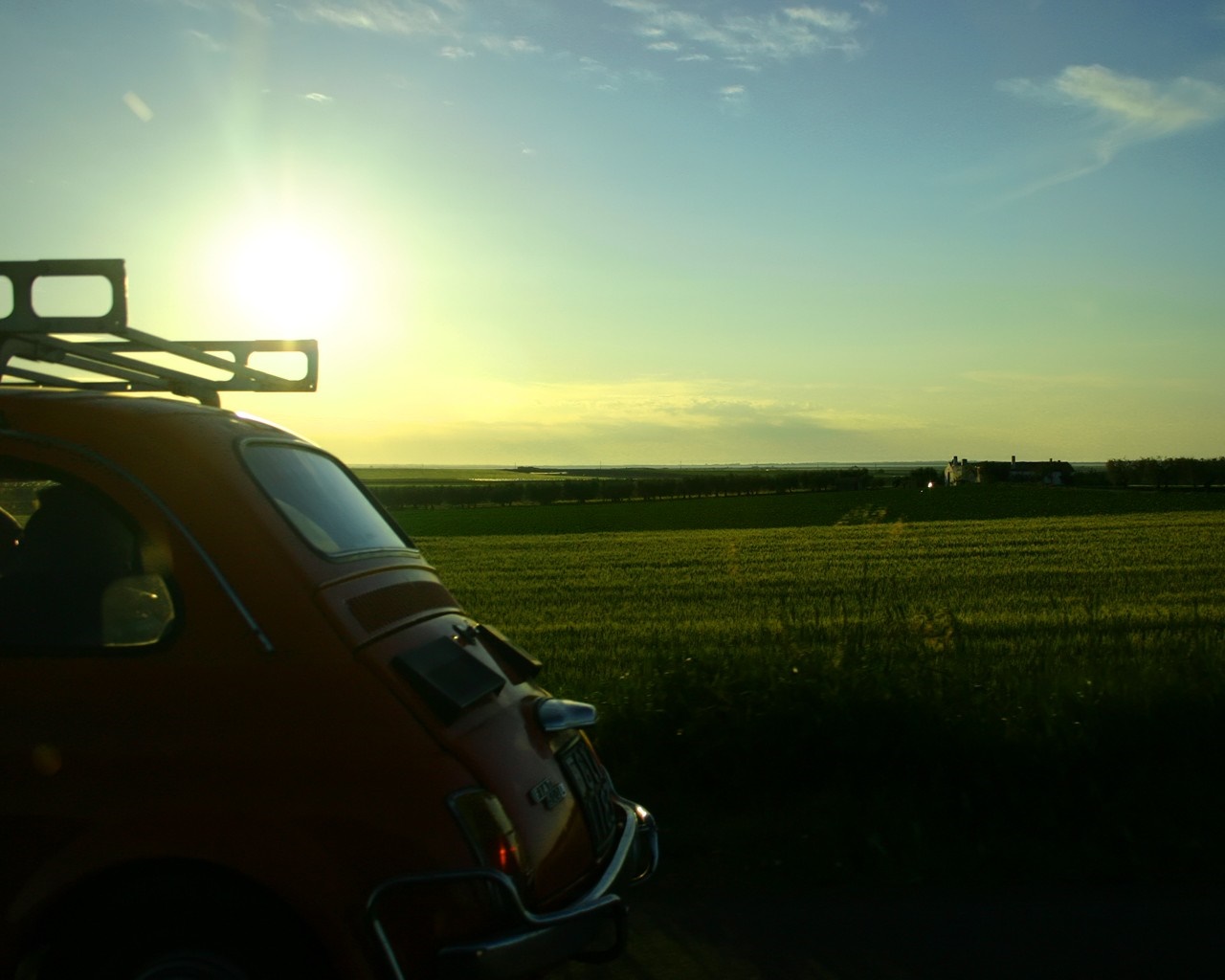 Orange Fiat 500 with roof rack at sunset HD Wallpaper