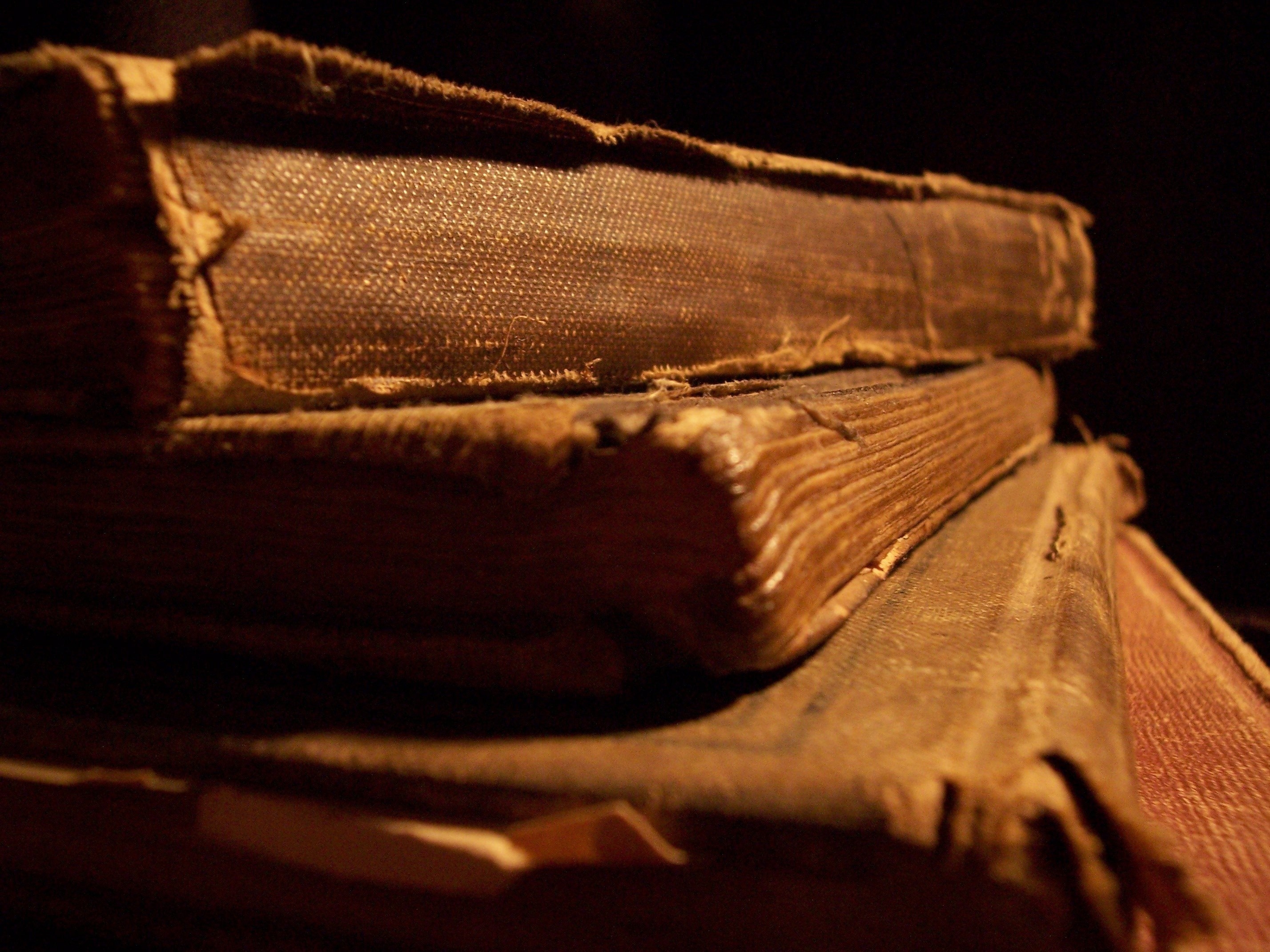 Stack of old, worn books HD Wallpaper