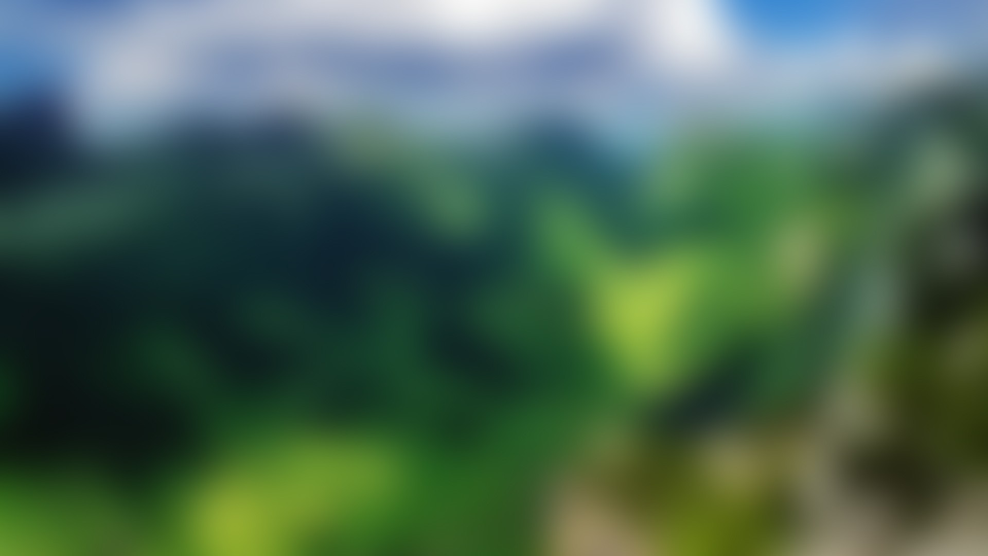 Blurred green landscape with blue sky and sunlight HD Wallpaper