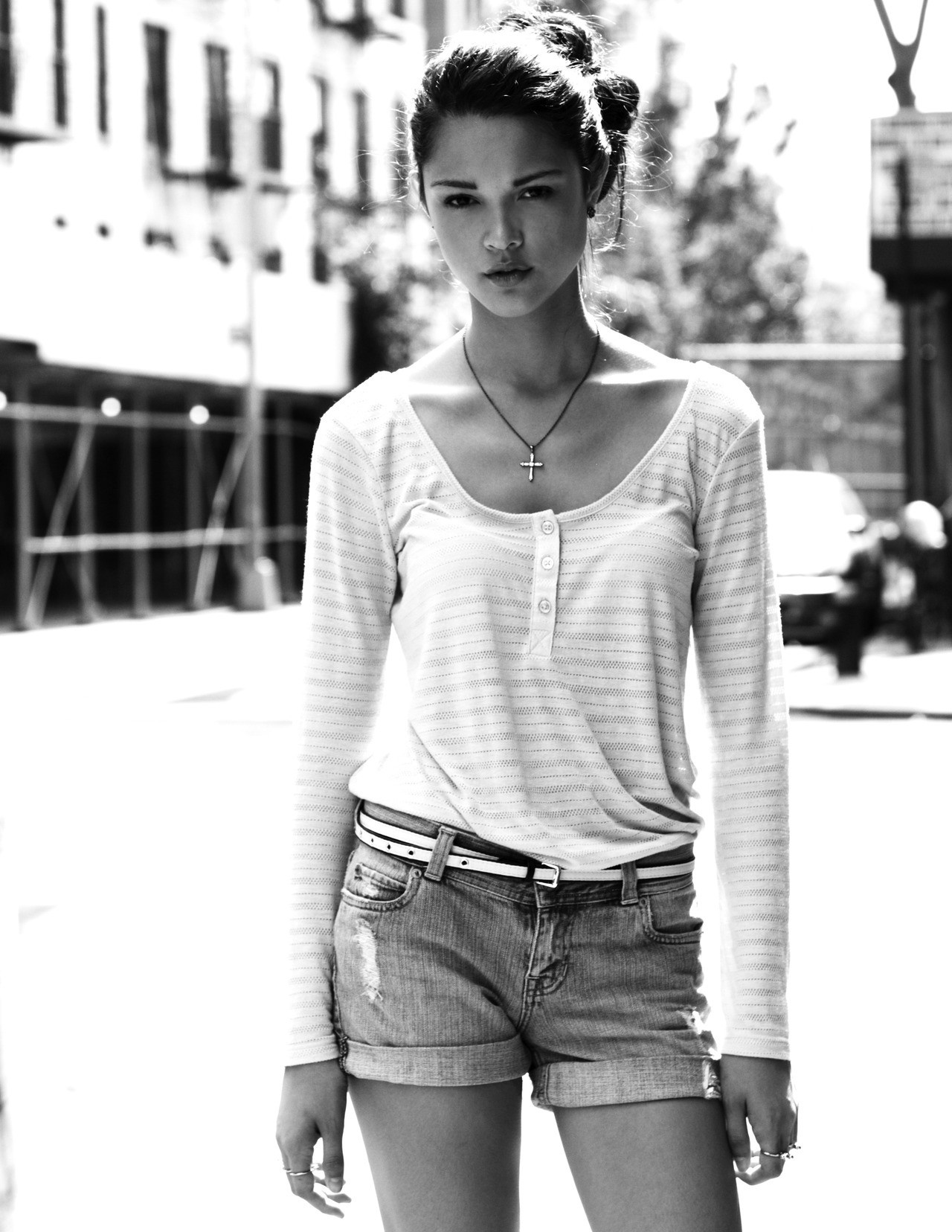 Woman in long-sleeved shirt and jean shorts outdoors HD Wallpaper