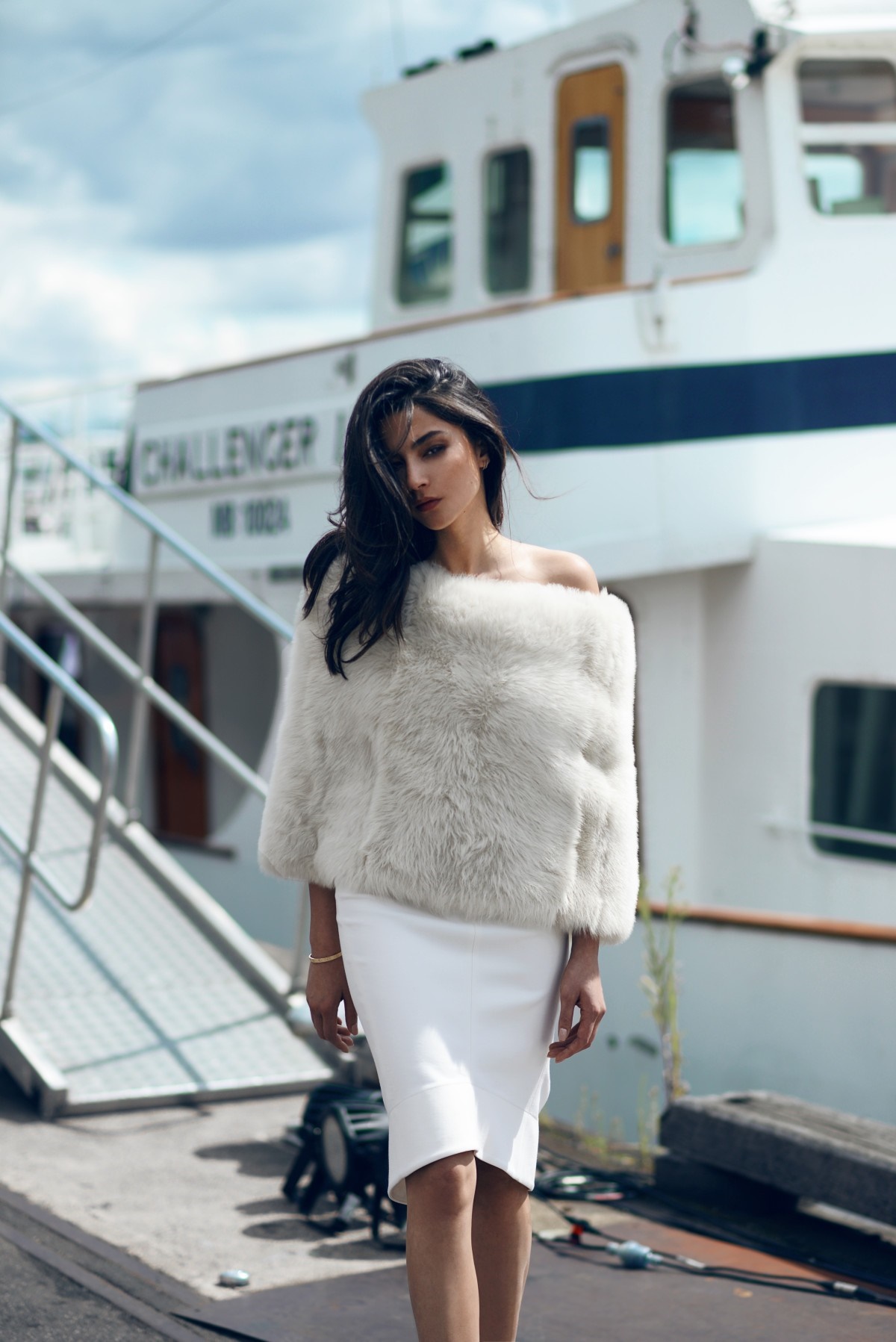 Woman in white fur and dress on a boat dock HD Wallpaper