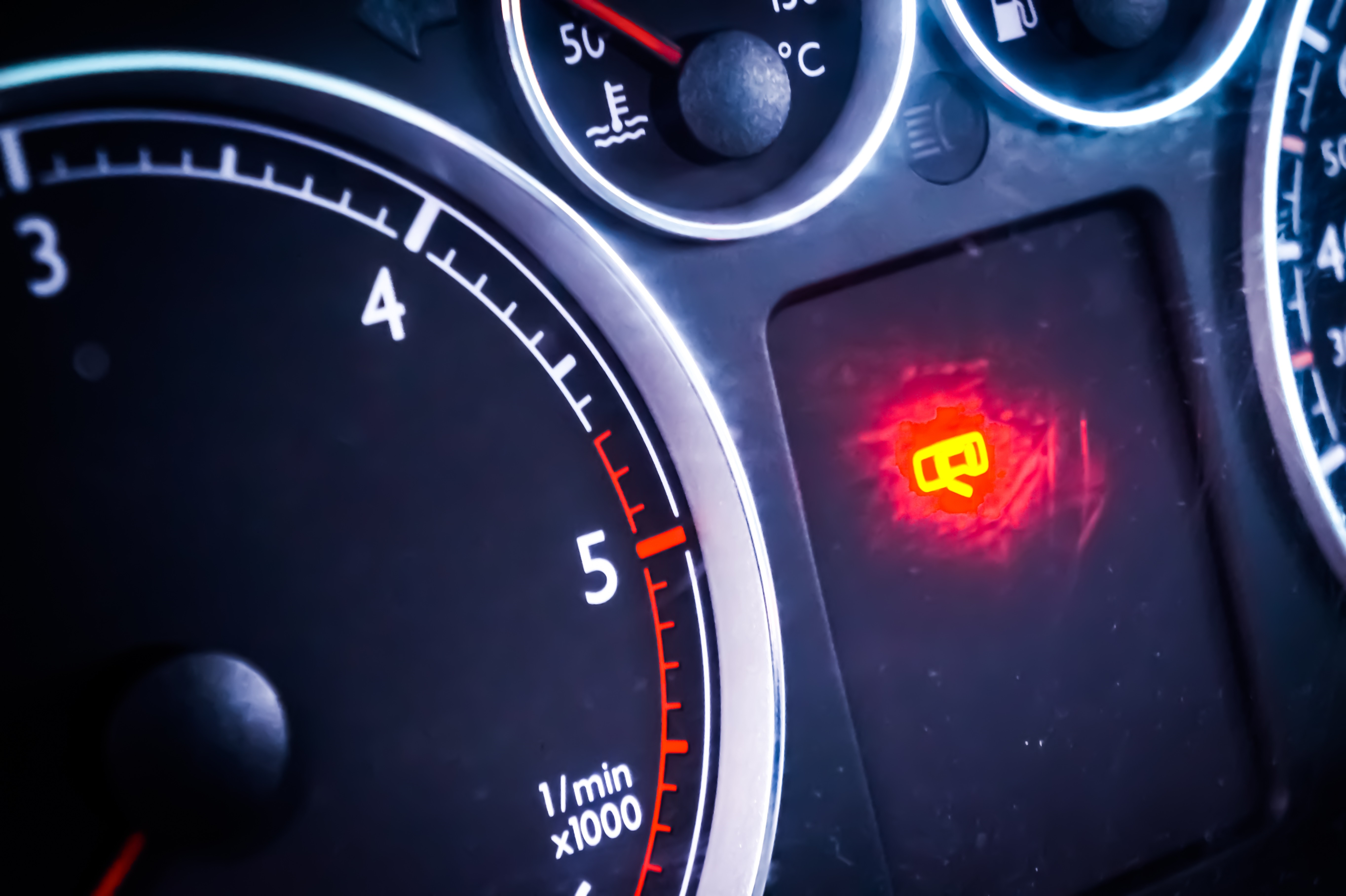 Car dashboard with warning light and gauges HD Wallpaper