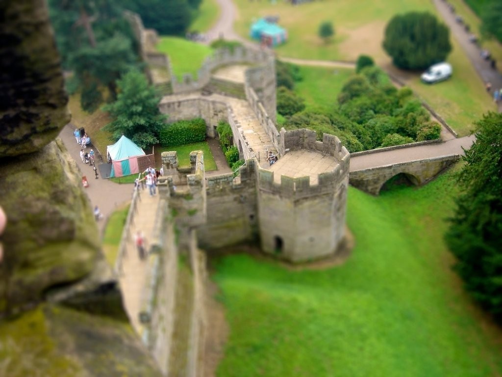 Castle walls and grounds with a tilt-shift effect HD Wallpaper