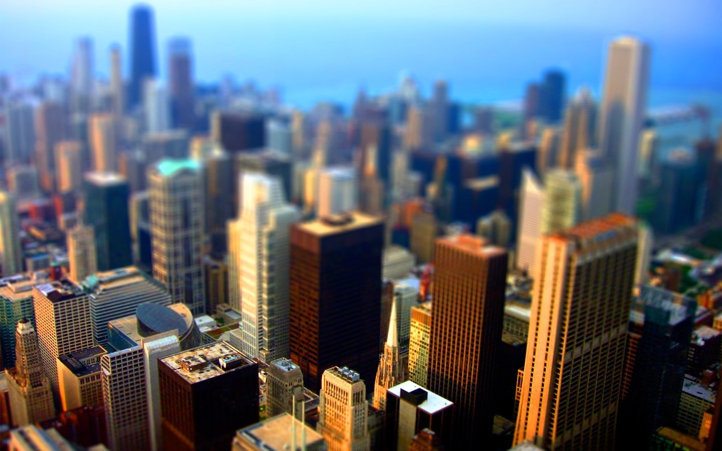 Tilt-shift cityscape of a modern metropolis at dusk HD Wallpaper